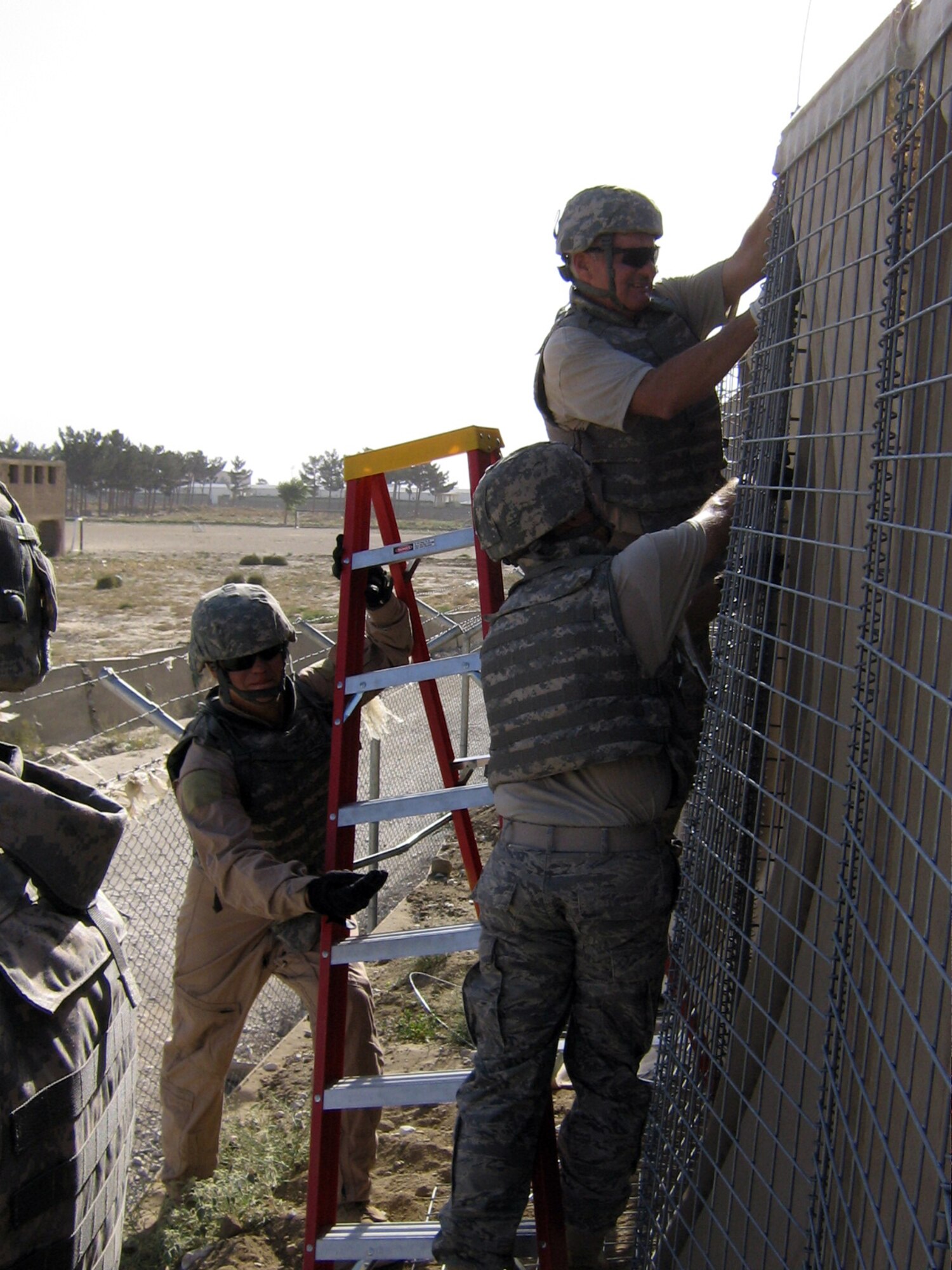 Reservists with the 755th Expeditionary Civil Engineer Squadron work on a construction project at Bagram Airfield in Afghanistan. The squadron was composed of Airmen from Dobbins Air Reserve Base and Westover ARB. The squadron constructed a multitude of projects at Bagram and were also tasked to go “outside the wire,” or off base. Projects were often from the ground up and included blackwater transfer facility, installation of air conditioning systems, electrical wiring of B-huts (housing structures) and billets, earthwork and concrete placement. 
