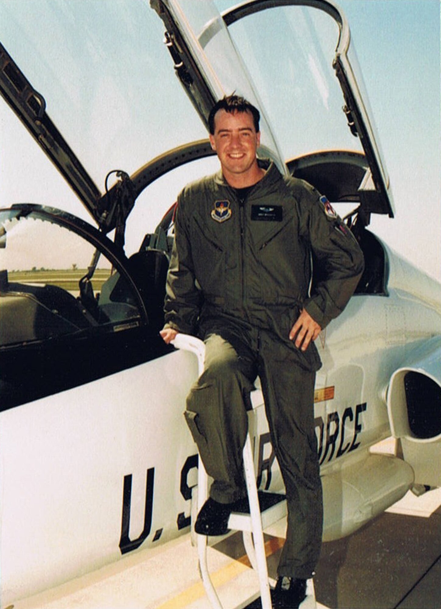 THE LONG BLUE LINE - Following in his grandfather's footsteps, Maj. Brent Brockington became a fighter pilot. Navy Capt. Richard Britson was an F-6F Hellcat pilot during World War II. His stories became life lessons for his grandson, an Air Force F-15C pilot. (Courtesy of Maj. Brent Brockington)