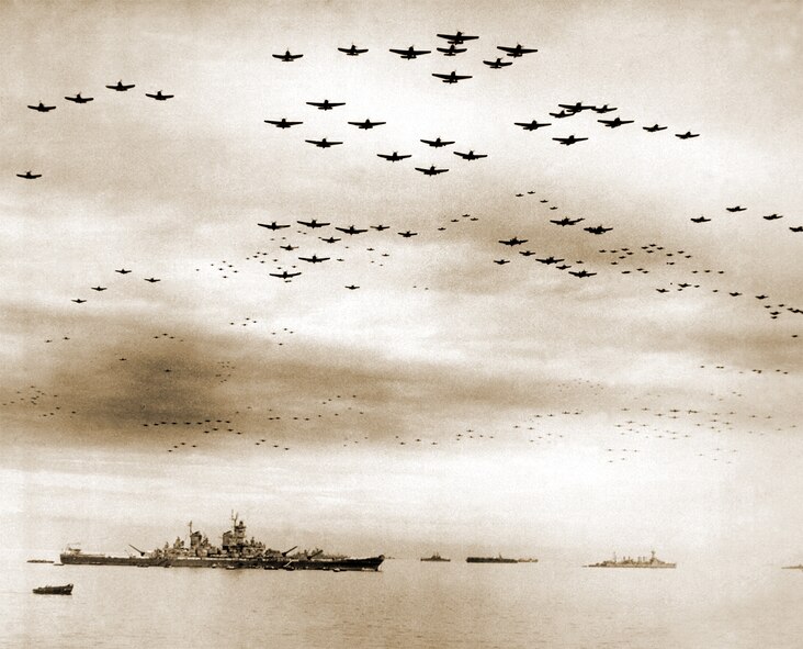 THE LONG BLUE LINE - Lessons from Grandfather's WWII Aerial Battles Ring True Today. During surrender ceremonies in Tokyo, Japan, F-4Us and F-6Fs fly in formation over the USS Missouri (left foreground) Sept. 2, 1945. (Courtesy Defense Imagery)