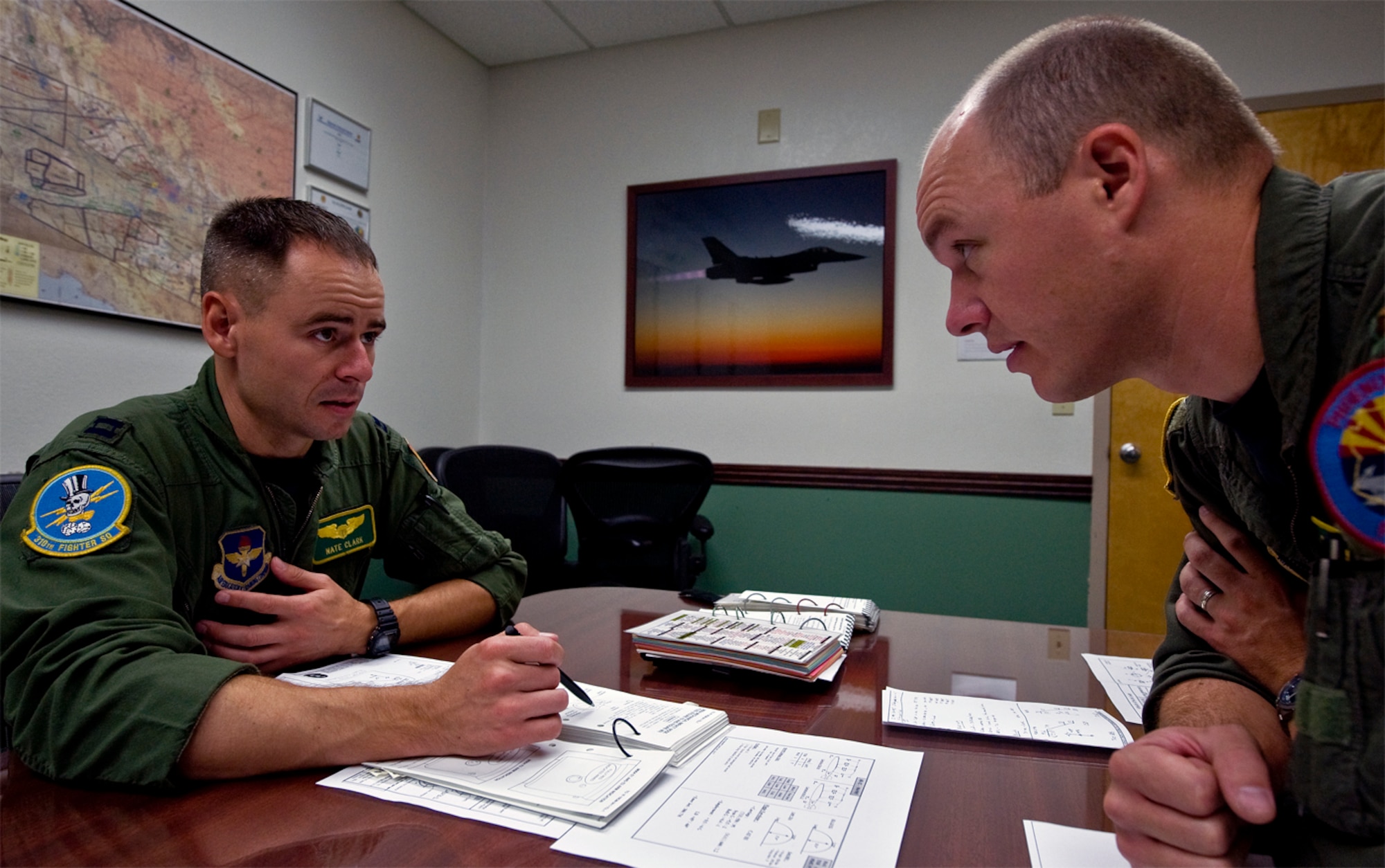 CREATING CANDOR - In a flight debrief, everyone makes constructive comments -- positive and negative -- regardless of their position or rank. (photo by Tech. Sgt. Matthew Hannen)