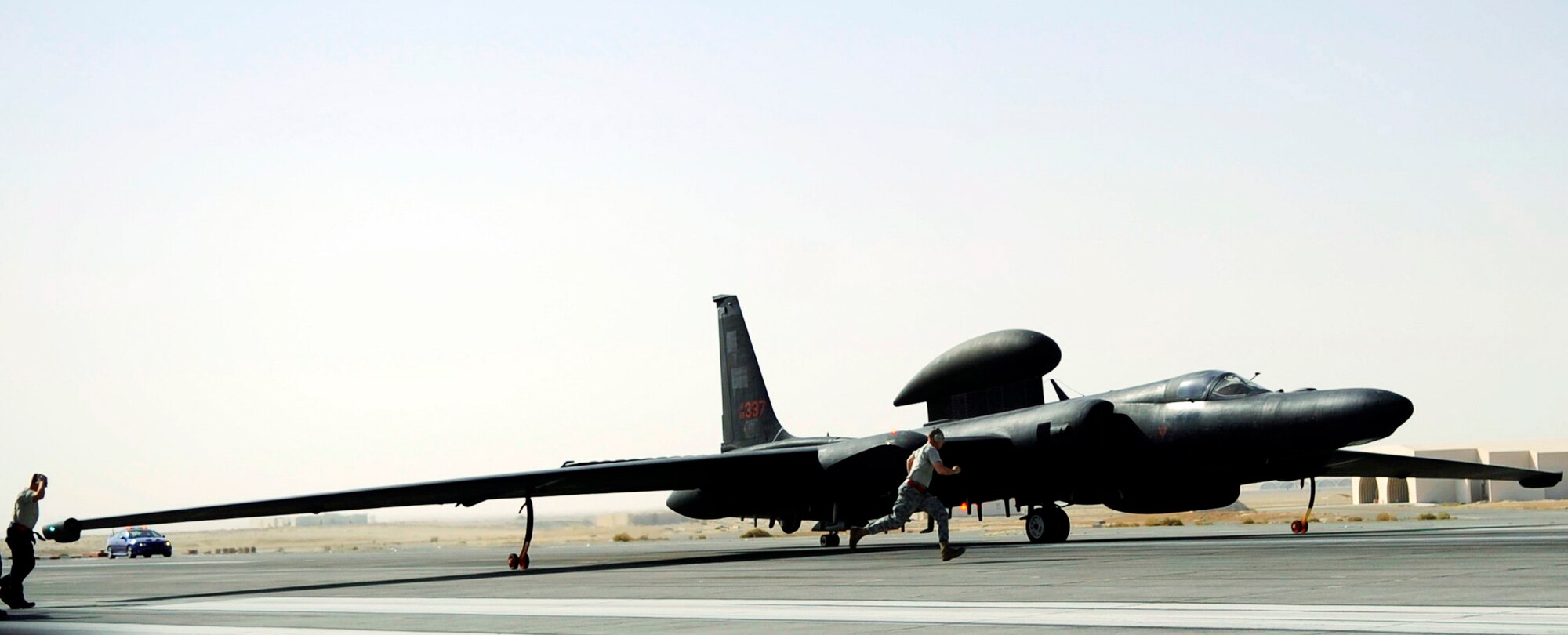 Airmen quickly remove the final pins from a U-2 before a flight Oct. 4, 2009. The sortie was Capt. Peter J. Gryn's first combat mission. The U-2 is the primary source of high-altitude intelligence, surveillance and reconnaissance. Captain Gryn is deployed from Beale Air Force Base, Calif. (U.S. Air Force photo/Staff Sgt. J.G. Buzanowski)