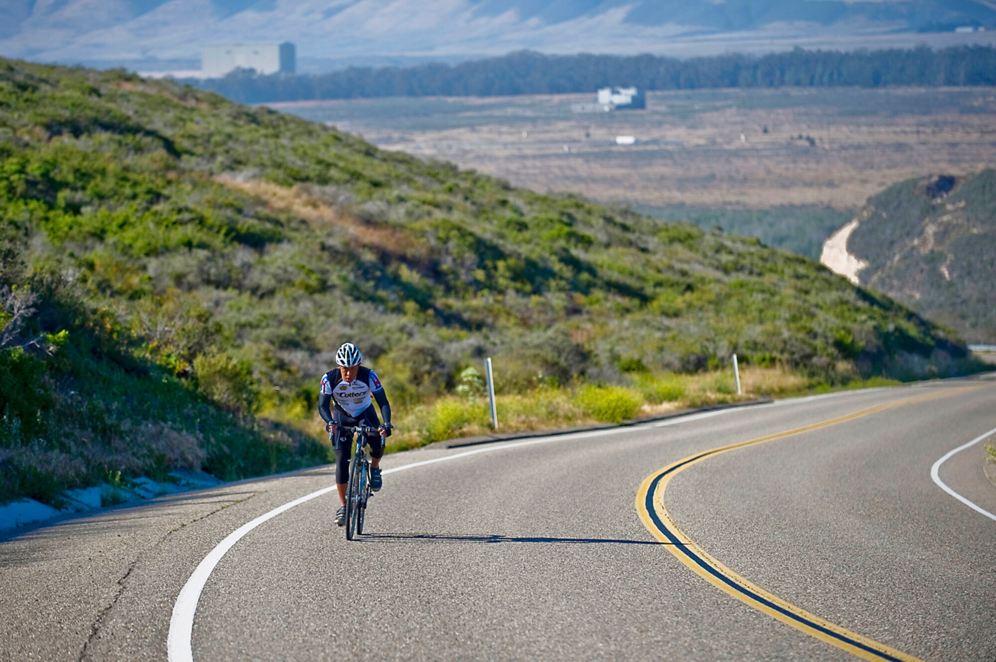 THIRD STRIKE ON BIKE - Surviving On Roads Filled With Motorists.Second Lt. Neil Samson survived three near-death experiences while training for the Ironman World Championships in Kona, Hawaii. (photo by Tech. Sgt. Matthew Hannen)