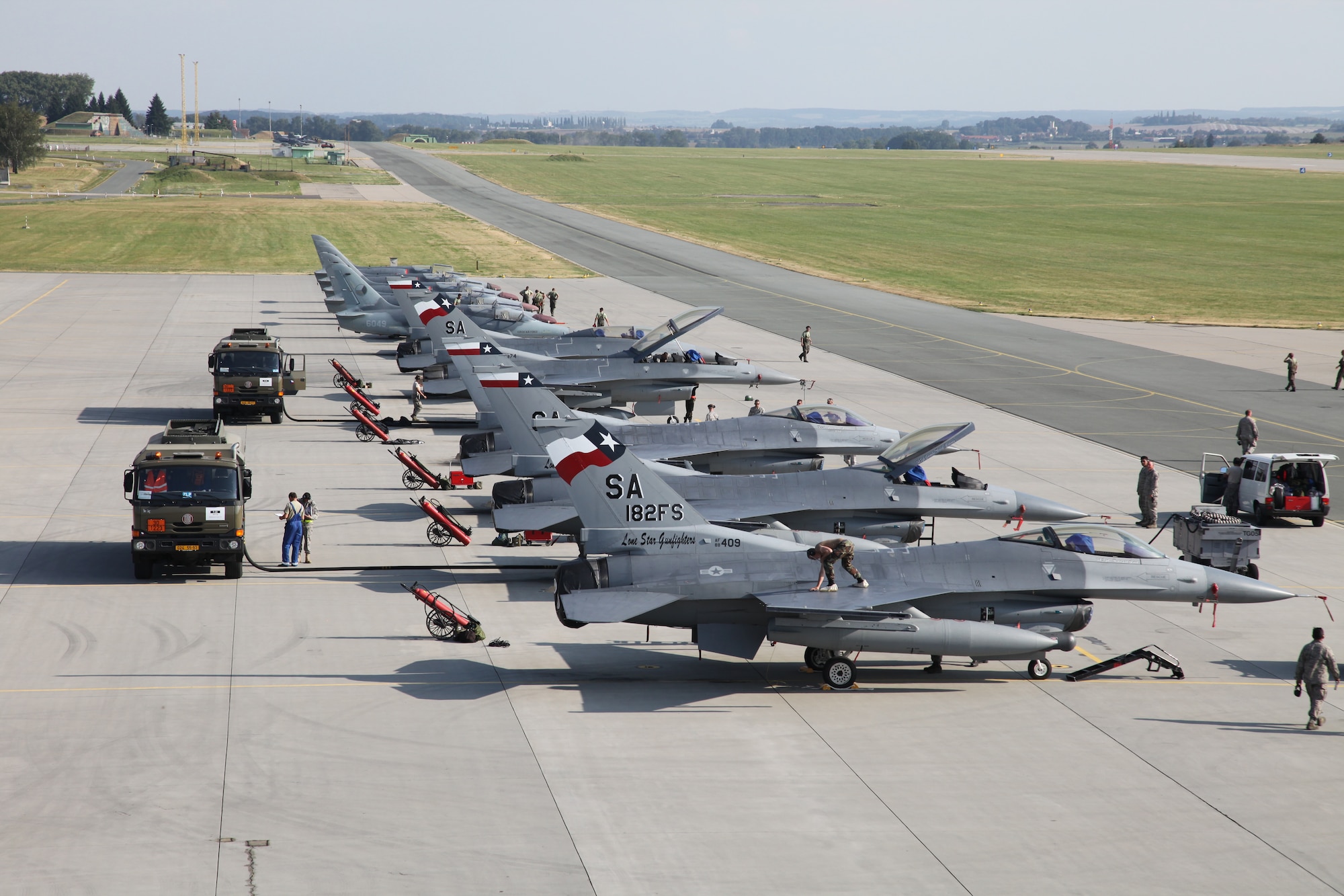 Czech Alcas and U.S. F-16s sit side-by-side on the ramp at Caslav Air Base.  Members of the Texas Air National Guard’s 149th Fighter Wing were in the Czech Republic conducting mutual training as part of the National Guard’s state partnership program.  (U.S. Air Force photo by Senior Master Sgt Miguel Arellano)