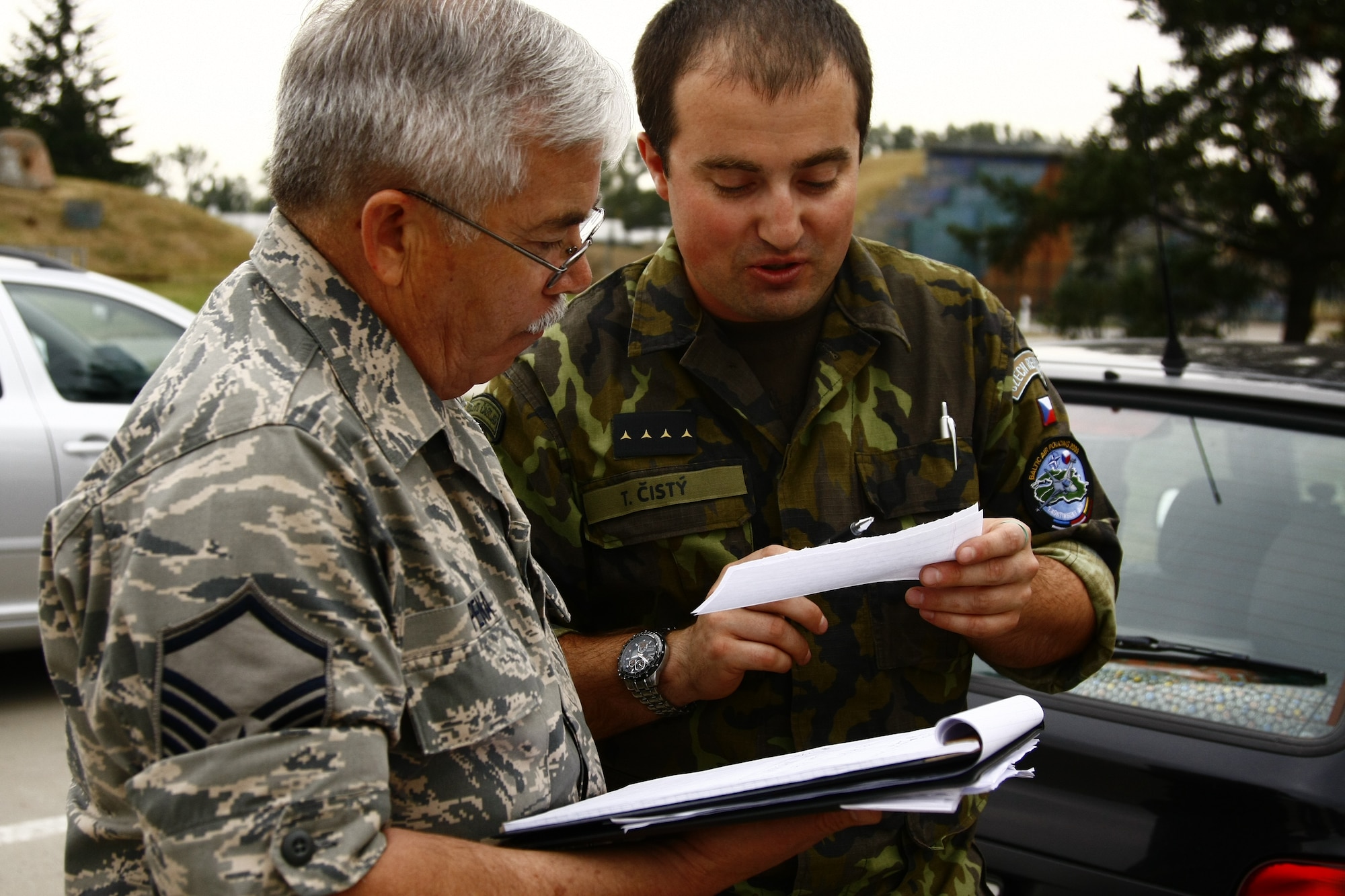 Contracting specialist Master Sgt Robert Pena works side-by-side with his Czech counterpart on purchasing issues.  Members of the Texas Air National Guard’s 149th Fighter Wing were in the Czech Republic conducting mutual training as part of the National Guard’s state partnership program.  (U.S. Air Force photo by Senior Master Sgt Miguel Arellano)