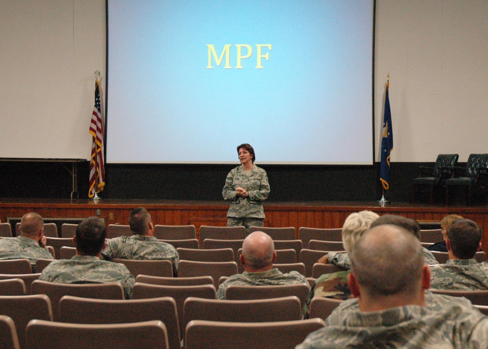 Senior Master Sgt. Patty Click, 919th Mission Support Flight superintendent, briefs Reserve members during the October UTA about benefits available to reservists and their families when members deploy.  Sergeant Click spoke to members during the wing-wide pre-deployment briefing designed to provide reservists information and support prior to deploying. (Air Force photo/Staff Sgt. Jon McCallum)