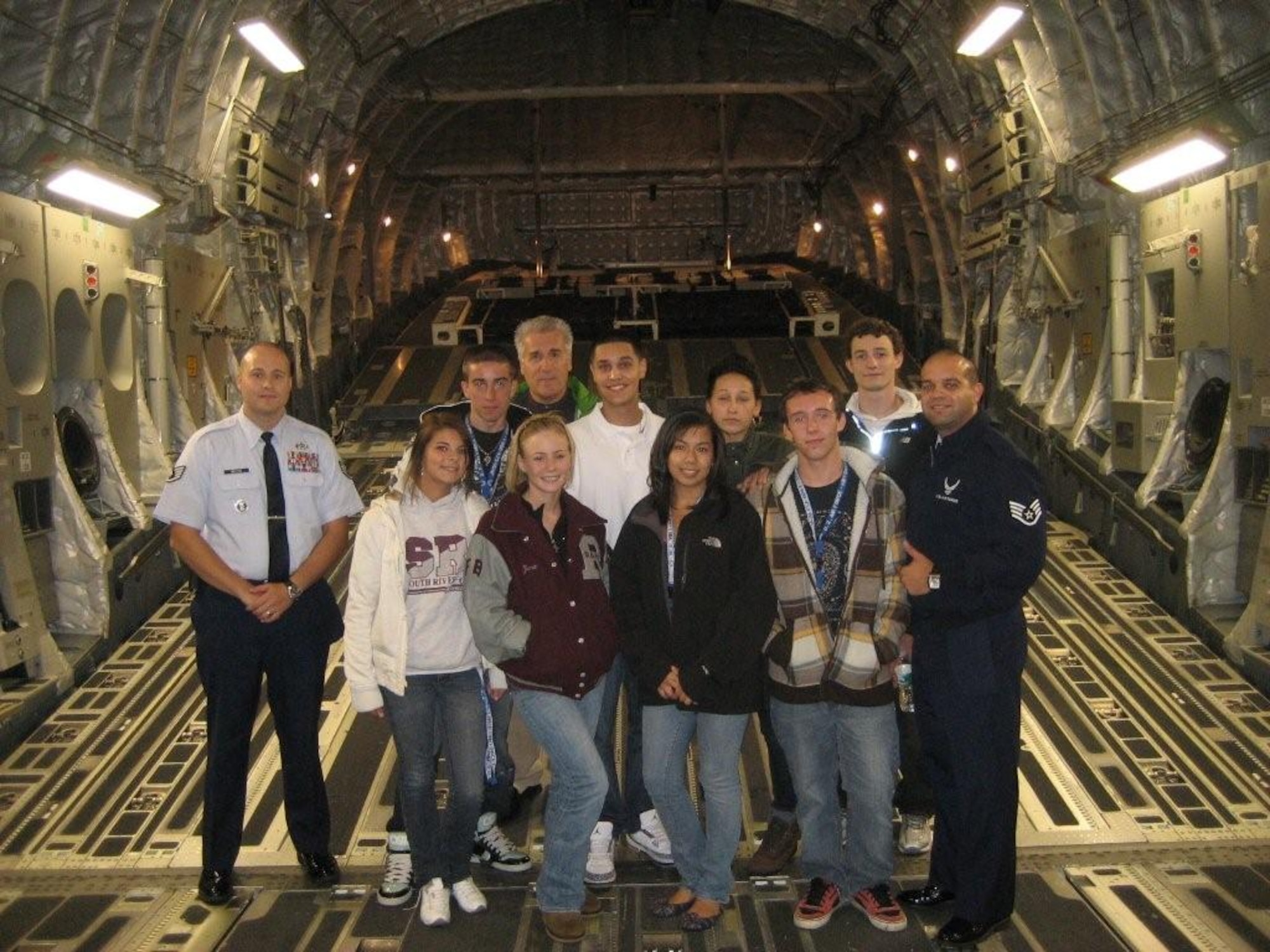 Staff Sgt. Weston and Staff Sgt. Ortiz, recruiters from the 314th Recruiting Squadron, and new recruits stand in the cargo bay of a McGuire C-17 Globemaster Sept. 30 here. The recuiters conducted a tour of the aircraft to explain how each Air Force specialty job plays an important role in maintaining Rapid Global Mobility.  That day, recruits also visited the base dining facility, library, education center and dormitories. (U.S. Air Force courtesy photo)