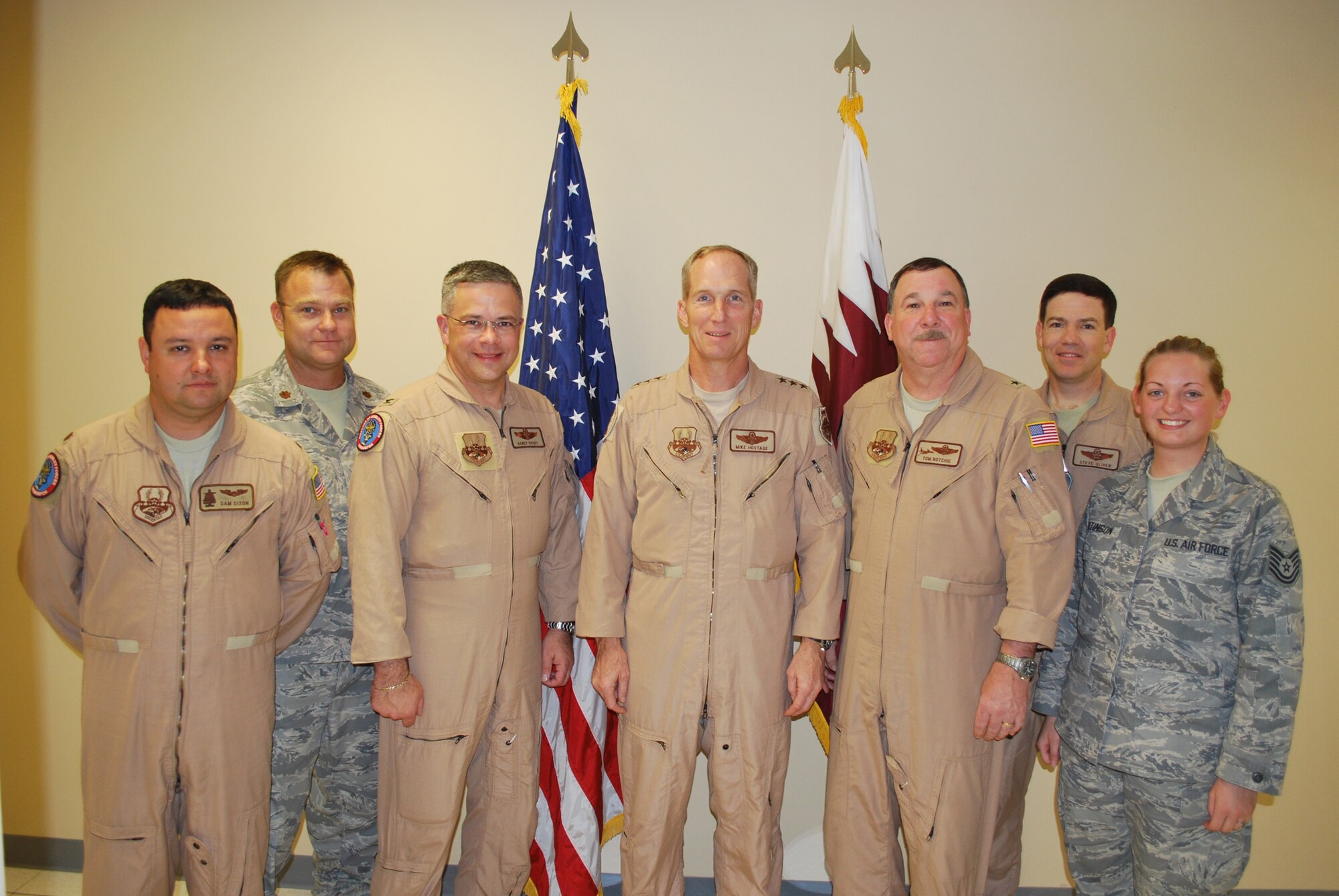 Col. Randal L. Bright, the 512th Airlift Wing commander who's currently serving as the deputy director of mobility forces-air in Southwest Asia, is pictured with Lt. Gen. Mike Hostage (center),  the Coalition Forces Air Component commander. Colonel Bright and his co-workers, also pictured, support the DIRMOBFOR who reports directly to General Hostage, the senior Air Force officer in charge of air forces of the AF, Navy and Marines. (U.S. Air Force photo)