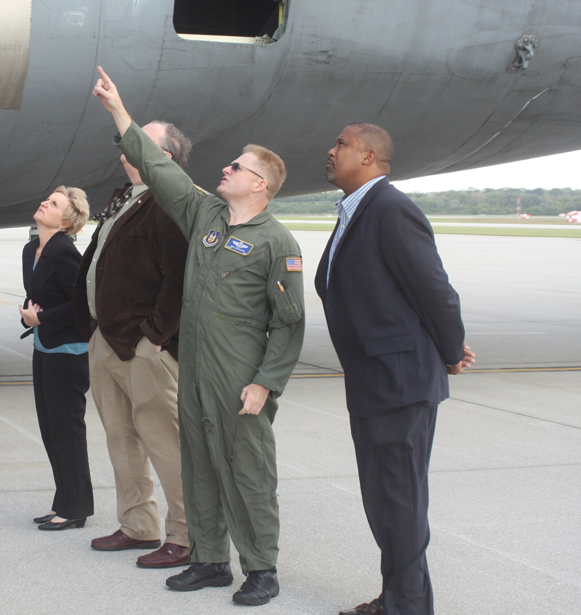 WRIGHT-PATTERSON AIR FORCE BASE, Ohio – Senior Master Sgt. Mike Kalbfleisch, 89th Airlift Squadron flight engineer, explains the mechanics of a C-5 Galaxy aircraft to Dayton Development Coalition members (from left to right) Karen Mauch, Director of Economic Development, Village of New Bremen; Don Jump, Wapakoneta City Council president; and James Cosby, WHIO-TV general sales manager, during a tour of the aircraft.  Thirty-three community leaders from the Dayton Development Coalition visited the 445th Airlift Wing as part of a base tour to Wright-Patterson Air Force Base, Ohio, Oct. 2. The Dayton Development Coalition is the regional economic development and advocacy organization whose mission is to support job creation and prosperity for the citizens of the Dayton Region. (U. S. Air Force photo/Stacy Vaughn)