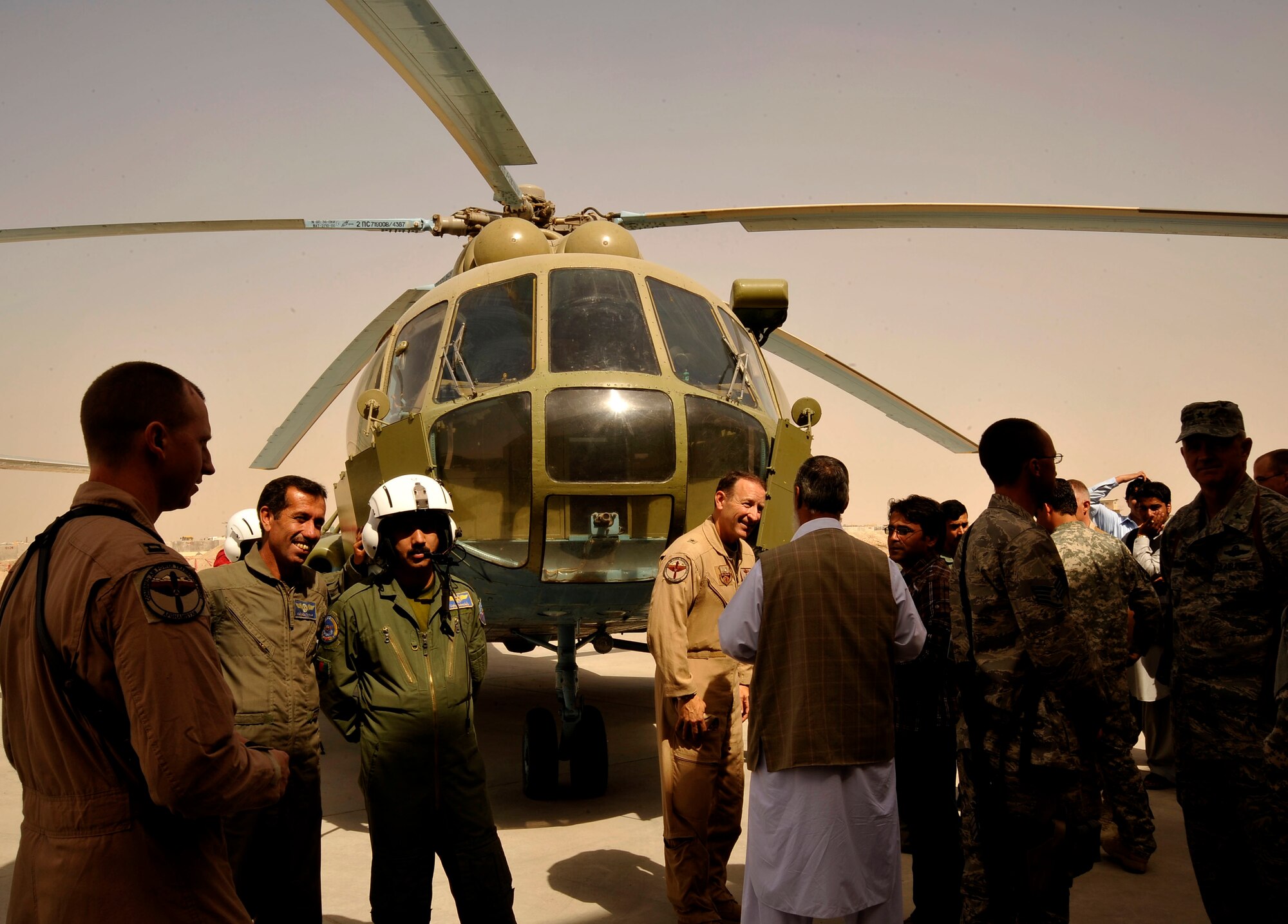 Afghan and coalition servicemembers and local dignitaries celebrate the activation of the Afghan National Army Air Corp's second wing Oct. 5, 2009 at Kandahar Air Field. The primary mission of the new wing is to move troops and supplies around the region and support smaller Afghan military detachments. (U.S. Air Force photo/Staff Sgt. Angelita Lawrence)
