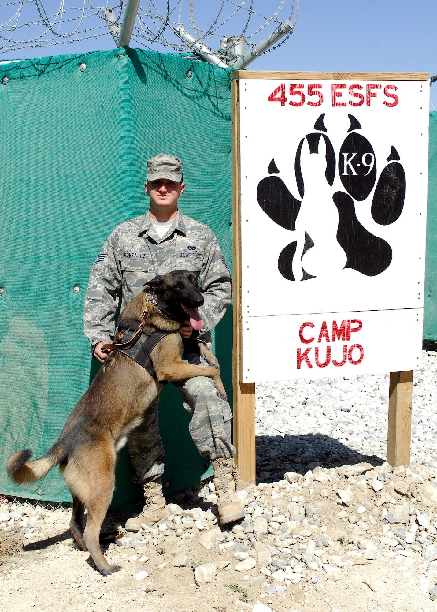 BAGRAM AIRFIELD, Afghanistan -- Staff Sgt. Steven Gonzalez, a dog handler from the 455th Expeditionary Security Forces Squadron, and his Military Working Dog, Bruno, are deployed to Bagram Airfield, Afghanistan.  When asked about their mission Sergeant Gonzalez said "We patrol the base perimeter." "He [Bruno] detects if anyone is outside the wire, he keeps us safe."  Sergeant Gonzalez is deployed from Davis-Monthan Air Force Base, Ariz., and hails from Converse, Ind.  (U.S. Air Force photo/Senior Airman Felicia Juenke)