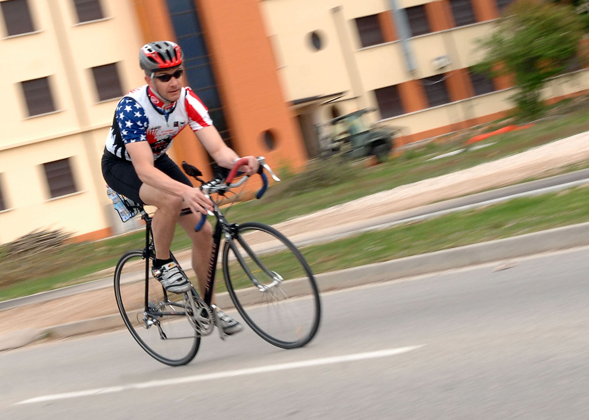 Lt. Col. Bo Bloomer, 31st Civil Engineer Squadron commander makes the final turn to the finish line of the 2009 U.S. Forces Europe Road Cycling Series race April 19, 2009 at Aviano Air Base, Italy. Colonel Bloomer used the men’s 53-kilometer course as a training ride in preparation for the Como Lake Man Triathon held Aug. 22, 2009, in Bellagio, Italy. (U.S. Air Force photo/Tech. Sgt. Michael O'Connor)