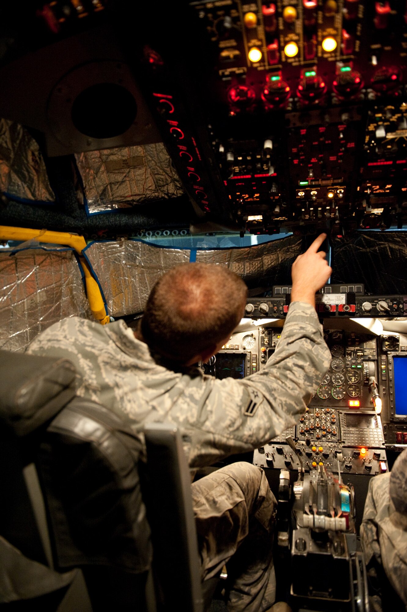 Airman 1st Class Jeremy Lowe, 55th Aircraft Maintenance Unit, conducts a post-flight inspection on a RC-135V/W Rivet Joint, Oct. 7, in Southwest Asia. Airman Lowe helped mark Oct. 7 as the 7,000th consecutive day the Rivet Joint has provided commanders in the U.S. Central Command area of responsibility near real-time on-scene intelligence collection, analysis and dissemination. Airman Lowe is deployed from Offutt Air Force Base, Neb., in support of Operations Iraqi and Enduring Freedom. (U.S. Air Force photo/Staff Sgt. Robert Barney) 