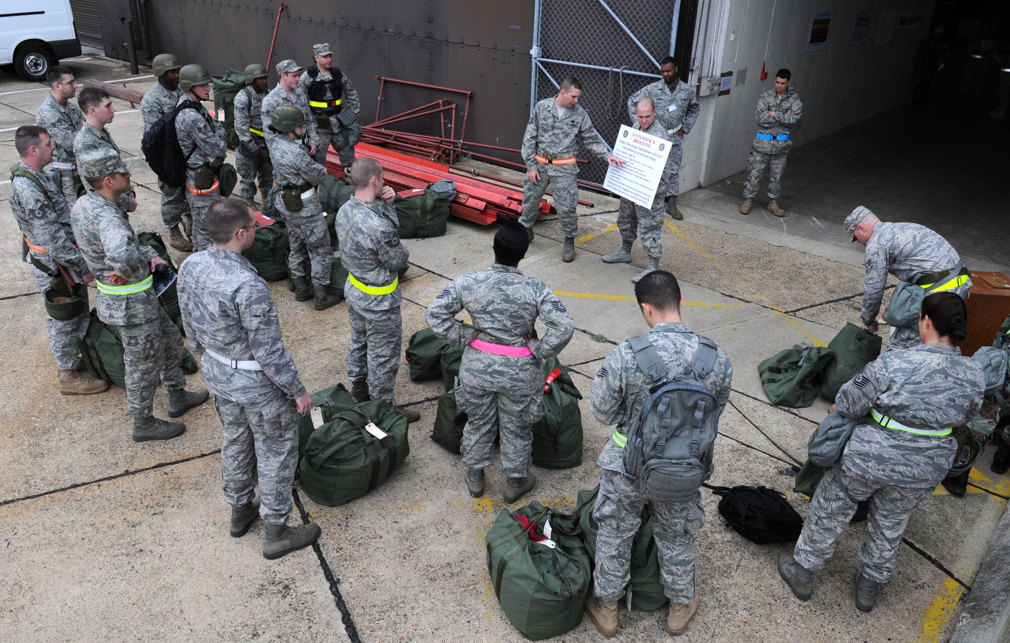 RAF MILDENHALL, England – Staff Sgt. Edward Bourgeois, 100th Logistics Readiness Squadron, briefs Airmen participating in the Phase I portion of the Operational Readiness Inspection outside Building 550 to ensure each individual bag is properly tagged and accounted for Oct. 7. (U.S. Air Force photo/ Staff Sgt. Jerry Fleshman)