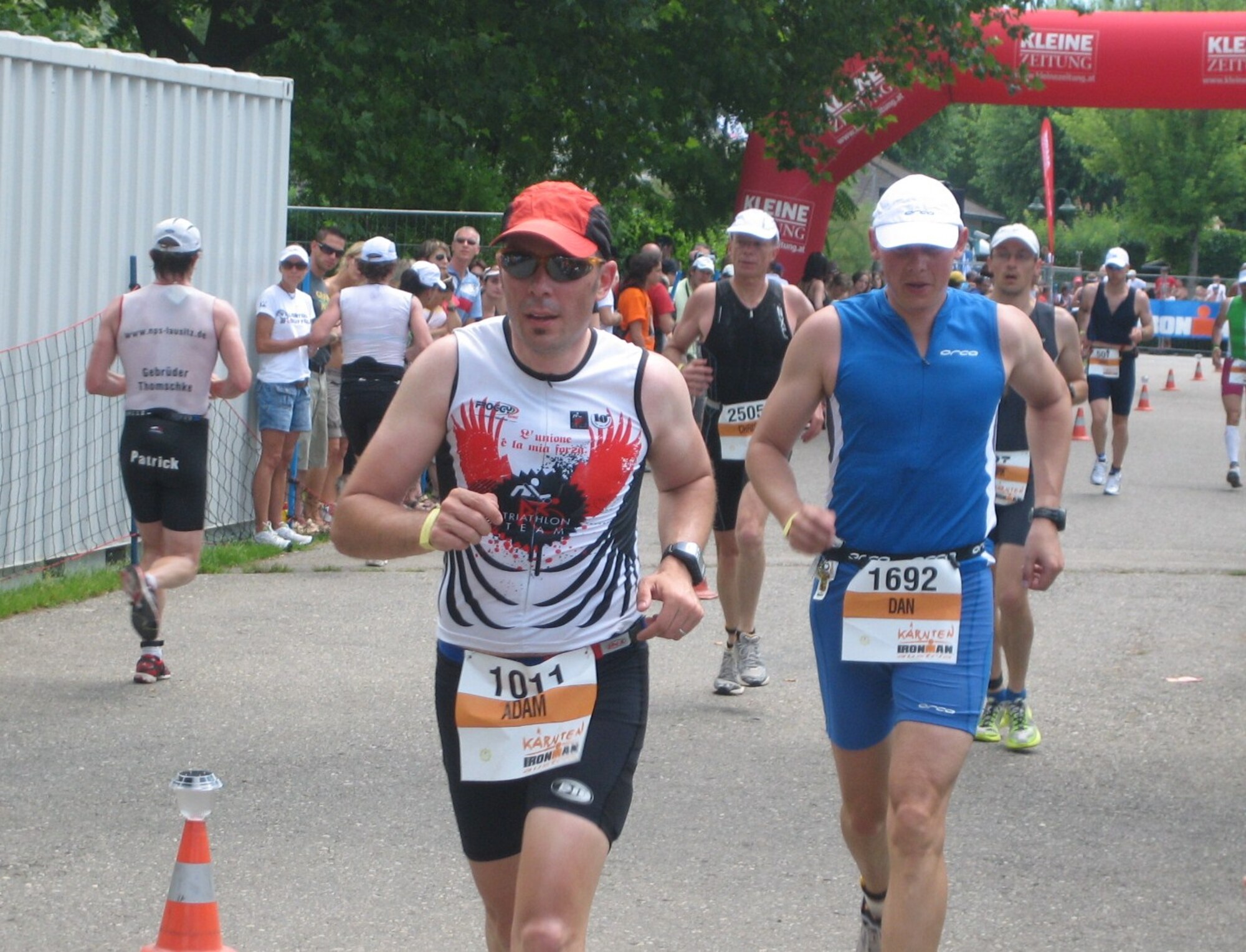 Adam Leigland (front left), 31st Civil Engineer Squadron deputy commander, makes his way to the finish line of the Como Lake Man Triathon held Aug. 22, 2009, in Bellagio, Italy.  This is the first year of this "Ironman" distance event in Bellagio challenging athletes to complete a 2.4-mile swim, 112-mile bike and a 26.2-mile run done in this order.  Mr. Leigland and Lt. Col. Bo Bloomer, 31st CES commander finished about 90 minutes apart.  (Courtesy photo)