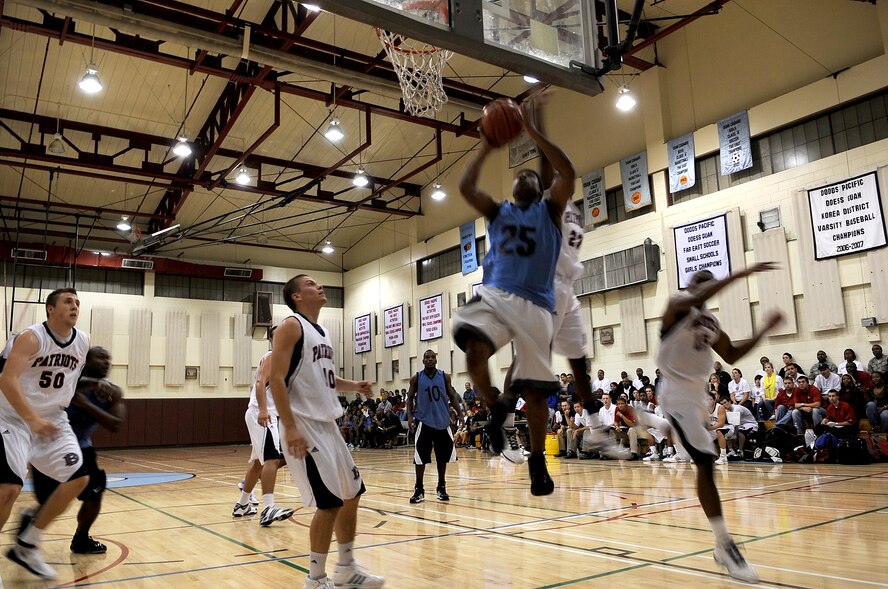 Detrus Graham, a member of the Team Osan Varsity Men's Basketball Team, goes up for a layup Oct. 6 during a game against the Dallas Baptist University Men's Basketball Team. 42 students, coaches, staff and trainers from DBU traveled to Korea as part of the university's "Global Sports Initiative," playing Korean university teams as well as the Osan team. (U.S. Air Force photo/1st Lt. Chris Hoyler) 