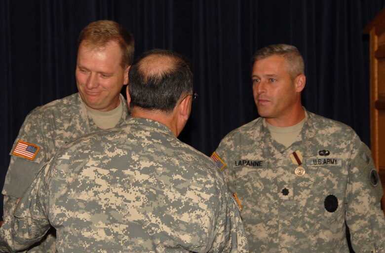 Delaware National Guard Adjutant General Maj. Gen. Frank Vavala congratulates Lt. Col. Joseph Bartel and Lt. Col. David LaPanne, both from the Del. Army Guard, during the Oct. 3, 2009 graduation ceremony for 19 graduates of the first class of the Delaware National Guard's Delaware Leadership Academy held at Del. ANG Headquarters in New Castle, Del. In addition to completing the regular coursework, each colonel completed all other requirements to earn 36 credits and their Master of Science Degree in Management with a concentration in Military Leadership from Wilmington University. (U.S. Air Force photo/Tech. Sgt. Tracy Childs)