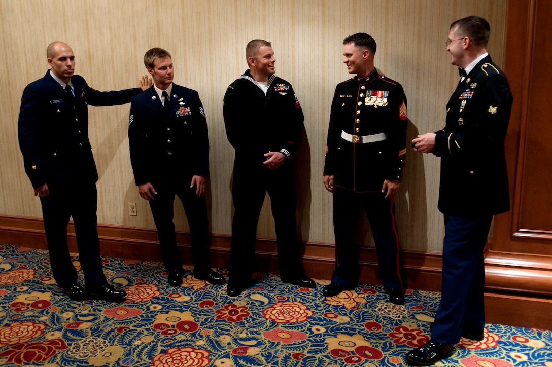 U.S. Coast Guard Petty Officer 2nd Class Abram H. Heller, U.S. Air Force Staff Sgt. Zachary J. Rhyner, U.S. Navy Petty Officer 2nd Class William S. Stevens, U.S. Marine Sgt. Mark A. Robinson and U.S. Army Spec. Michael D. Carter gather before a ceremony recognizing each of them as a USO Servicemember of the Year at the 2009 USO Gala, Washington, D.C., Oct. 7, 2009.





