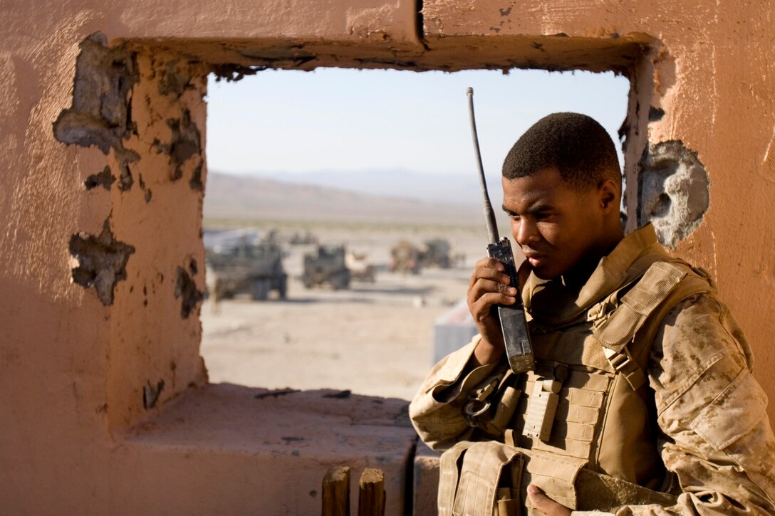 U.S. Marine Corps Lance Cpl. Andrew L. Maxwell performs a radio check on his equipment during Enhanced Mojave Viper, an exercise on Marine Corps Air Ground Combat Center, Twentynine Palms Calif., Sept. 27, 2009. Maxwell is a forward air controller radio operator attached to Bravo Company.