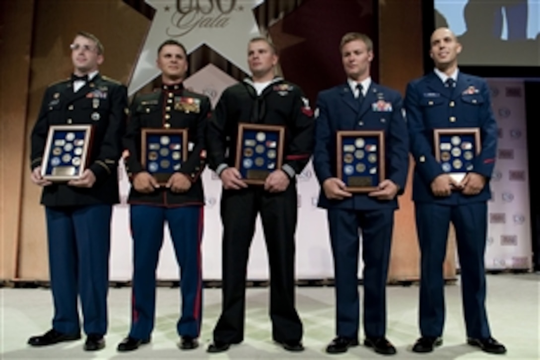 U.S. Army Spc. Michael D. Carter, U.S. Marine Sgt. Mark A. Robinson,  U.S. Navy Petty Officer 2nd Class William S. Stevens, U.S. Air Force Staff Sgt. Zachary J. Rhyner, and U.S. Coast Guard Petty Officer 2nd Class Abram H. Heller are the  Servicemembers of the Year for their individual branches at the 2009 USO Gala, Washington, D.C., Oct. 7, 2009. 