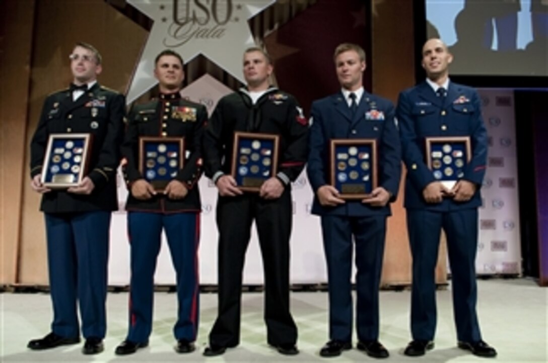 U.S. Army Spc. Michael D. Carter, U.S. Marine Sgt. Mark A. Robinson, U.S. Navy Petty Officer 2nd Class William S. Stevens, U.S. Air Force Staff Sgt. Zachary J. Rhyner and U.S. Coast Guard Petty Officer 2nd Class Abram H. Heller are presented as the Service Members of the Year for their individual branches at the 2009 USO Gala at the Marriott Wardman Park in Washington, D.C., on Oct. 7, 2009.  