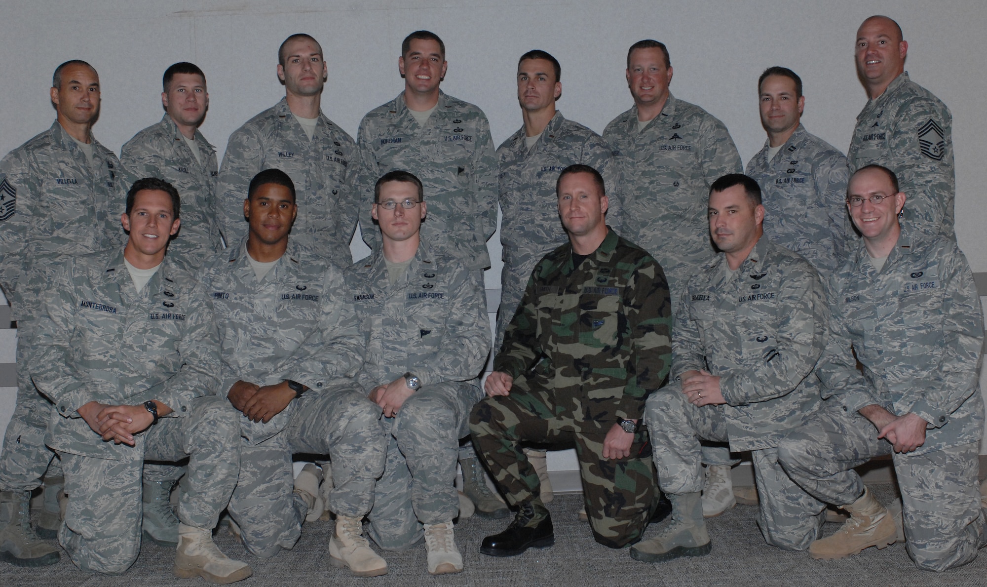 NELLIS AIR FORCE BASE, Nev. -- Graduates from the 6th Air Liaison Officer Qualification course pose for a picture during a ceremony Oct. 8. The graduates are (Front Row from left to right) 1st Lt. Frank Monterrosa, 2nd Lt. Brandon Pinto, 2nd Lt. Chris Swanson, 2nd Lt. Michael Smith, 2nd Lt. John Grucella, 2nd Lt. Abel Wilson; (Back Row left to right) 2nd Lt. Steven Kroll, 2nd Lt. Matthew Willey, 2nd Lt. Michael Hoffman, 2nd Lt. Dennis Seay, 1st Lt. Christopher Deaver, Capt. Matthew McMurty. Chief Master Sgt. Mark Villella (left), 93rd Air Ground Operations Wing command chief, and Chief Master Sgt. Roger Cross (right), 57 Operations Group superintendent,  attended the ceremony as distinguished guests to the ceremony. (U.S. Air Force photo by Airman Cynthia A. Haughton)