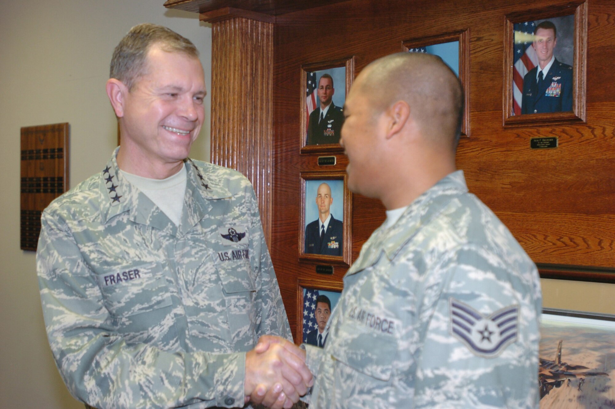 FORT HOOD, Texas -- Gen. William M. Fraser III, commander of Air Combat Command, shakes hands with Staff Sgt. Ae Khone Sappasith, 3rd Air Support Operations Group personnel resource manager, during a visit to Fort Hood, Texas, Oct. 7-8. Fort Hood has the largest contingent of Air Force members assigned to an Army post. (U.S. Army photo/Chris Haug)