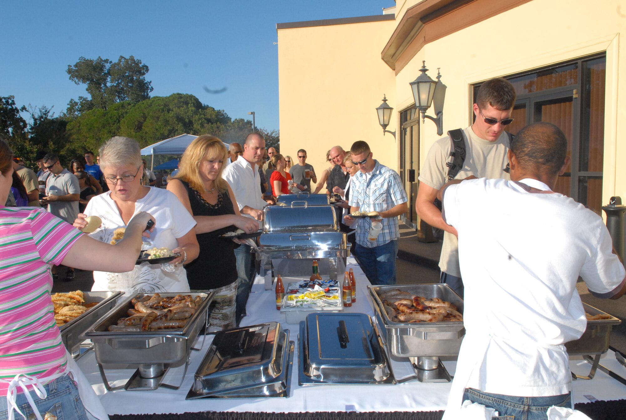 Guests fill their plates with an authentic German meal of bratwurst, schnitzel, and other German delicacies during Barksdale's second annual Oktoberfest Oct. 2. (U.S. Air Force Photo by Airman 1st Class Joseph Boals)