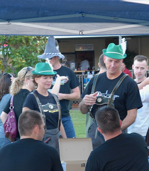 Maj. Gen. Floyd Carpenter and his wife, Melissa, stand in line to get tickets to take part in the food festivities of Barksdale’s second annual Oktoberfest Oct. 2. (U.S. Air Force Photo by Airman 1st Class Joseph Boals)