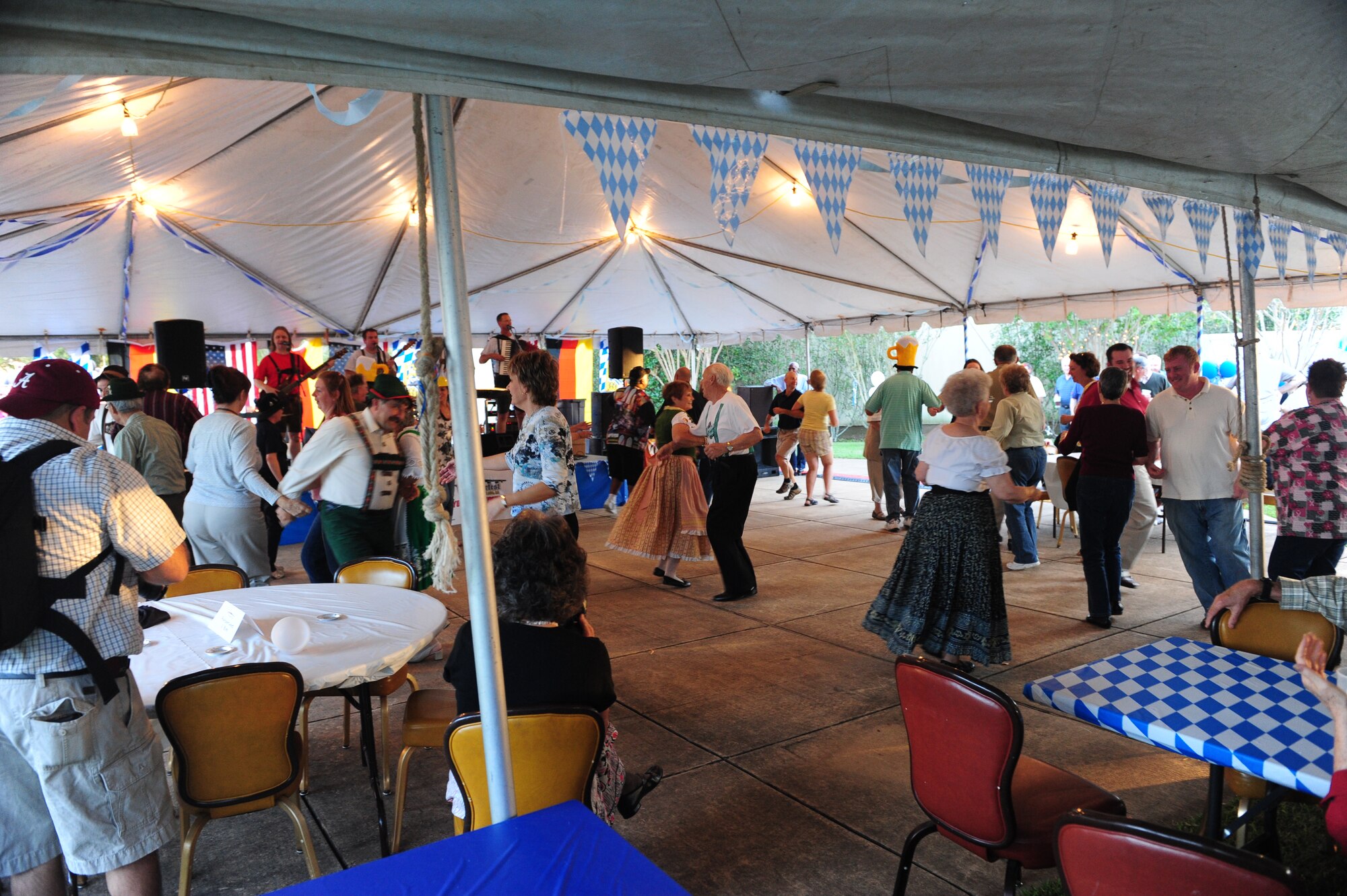 Guests at the second annual Barksdale Oktoberfest celebration dance to the music of Alpen-Musikanten, an authentic German oompah band from Dallas. This year’s Oktoberfest featured music, dancing, displays and a German buffet featuring bratwurst, schnitzel and sauerkraut. (U.S. Air Force photo by Staff Sgt. Mike Andriacco)