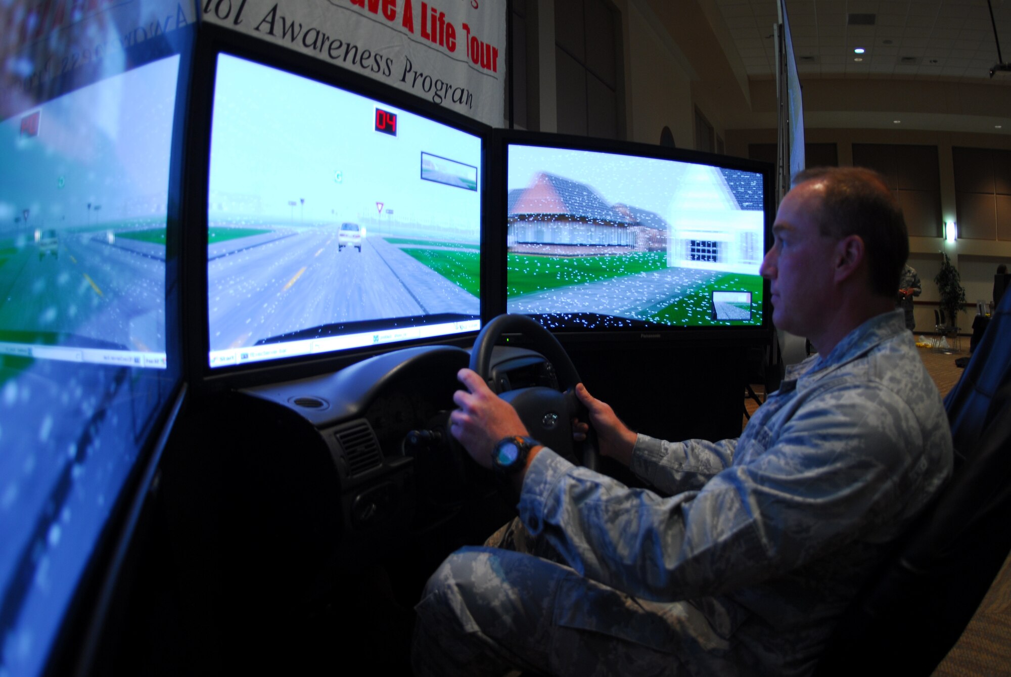 Buckley Air Force Base, Colo. — Maj. Todd Tomlin, 460th Medical Support Squadron, attempts the drunk driver simulator during the Fall Safety Campaign Oct. 8. The simulator gives the driver the sensation of .34 BAC. The base safety office put together the Wingman Day Fair to help build strong wingmen and a safer Team Buckley. (U.S. Air Force photo by Staff Sgt. Anika K. Williams)