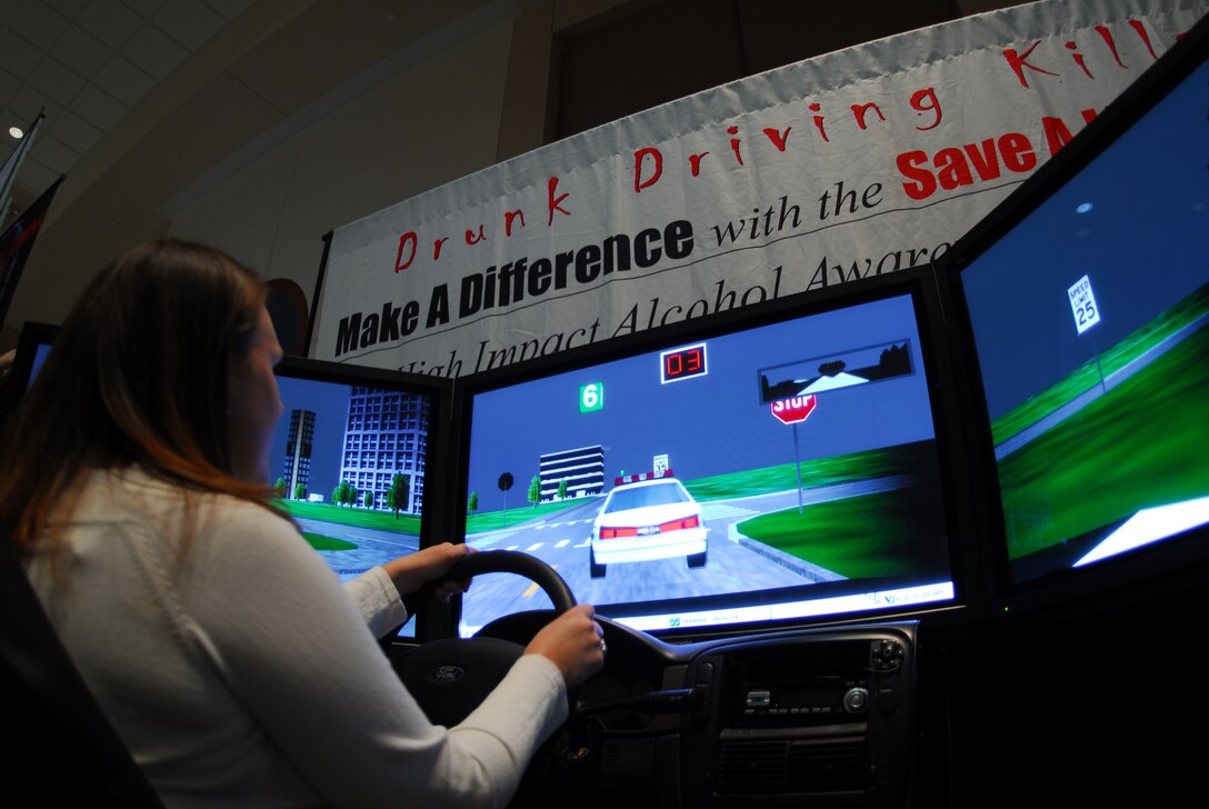 Buckley Air Force Base, Colo. — Maryann Rangel, 460th Medical Group, attempts the drunk driver simulator during the Fall Safety Campaign on Oct. 8. The simulator gives the driver the sensation of .34 percent blood alcohol content. The base safety office put together the Wingman Day Fair to help build strong Wingmen and a safer Team Buckley. (U.S. Air Force photo by Staff Sgt. Anika K. Williams)