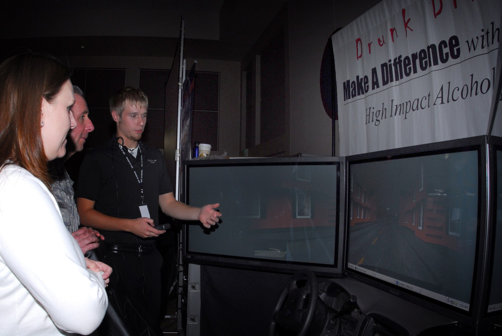 Buckley Air Force Base, Colo. — Christian Nicholls, Save-a-Life Tour representative, explains the drunk driver simulator during the Fall Safety Campaign Oct. 8. The base safety office put together the Wingman Day Fair to help build strong Wingmen and a safer Team Buckley. (U.S. Air Force photo by Staff Sgt. Anika K. Williams)