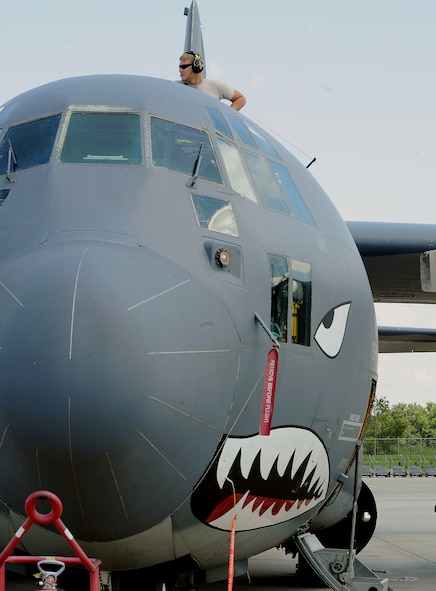 MOODY AIR FORCE BASE, Ga. -- Senior Airman Jason Steinbach, 723rd Aircraft Maintenance Squadron crew chief, checks a dry panel on top of a HC-130P/N Combat King as he performs a routine check here. (U.S. Air Force photo by Airman 1st Class Joshua Green)