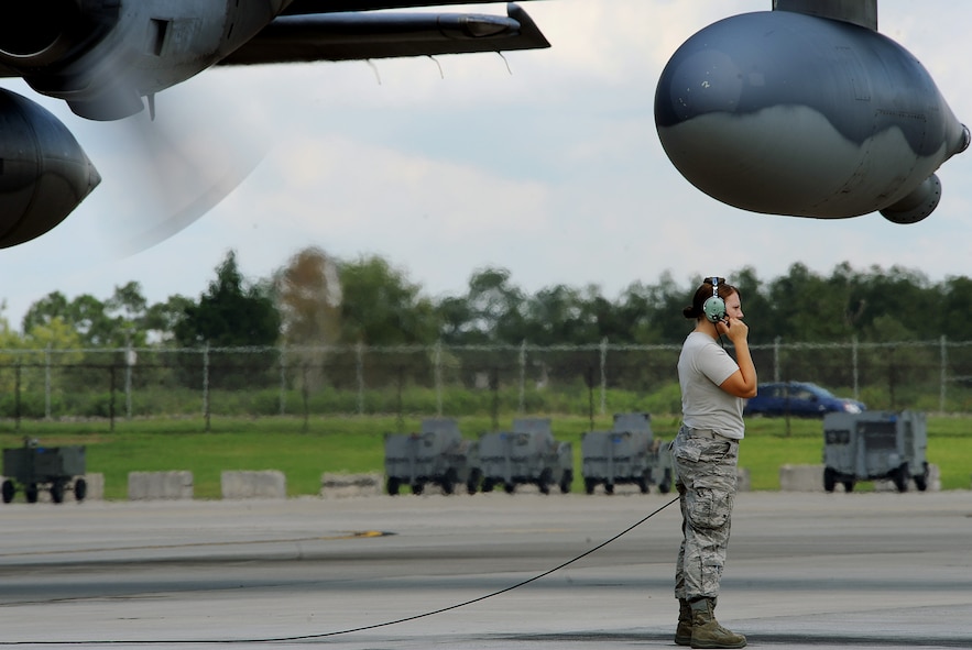 MOODY AIR FORCE BASE, Ga. -- Airman 1st Class Carissa Lorenz, 723rd Aircraft Maintenance Squadron crew chief, performs standing ground for a HC-130P/N Combat King due to technical difficulties here. Standing ground is when an aircraft maintenance member checks for anything out of the ordinary while the aircraft is running on the ground. (U.S. Air Force photo by Airman 1st Class Joshua Green) 