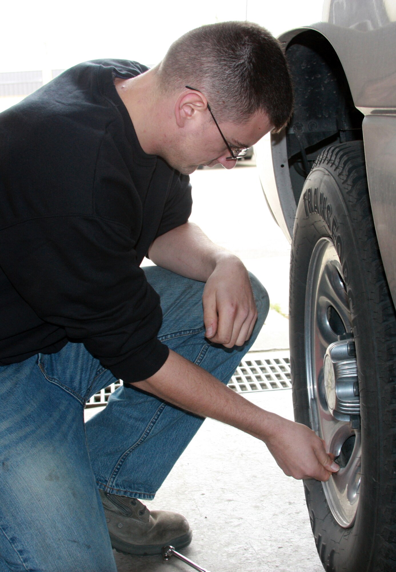 Airman Zachary Wynne checks the air pressure in a tire during the 341st Logistics Readiness Squadron's winter vehicle inspections Oct. 3. The free inspections continue Saturday and Sunday from 10 a.m. to 2 p.m. in building 870. (U.S. Air Force photo/Tech. Sgt. Marcus McDonald)