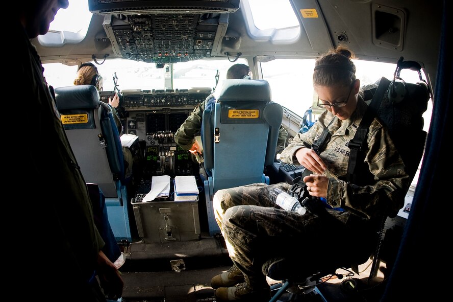 1Lt Mica Myers, 62nd Communications Squadron, settles into her seat aboard a C-17 Globemaster III prior to departing McChord on a spouses incentive flight Oct 9, during a Year of the Air Force Family orientation flight at McChord AFB. (U.S. Air Force Photo/Abner Guzman)