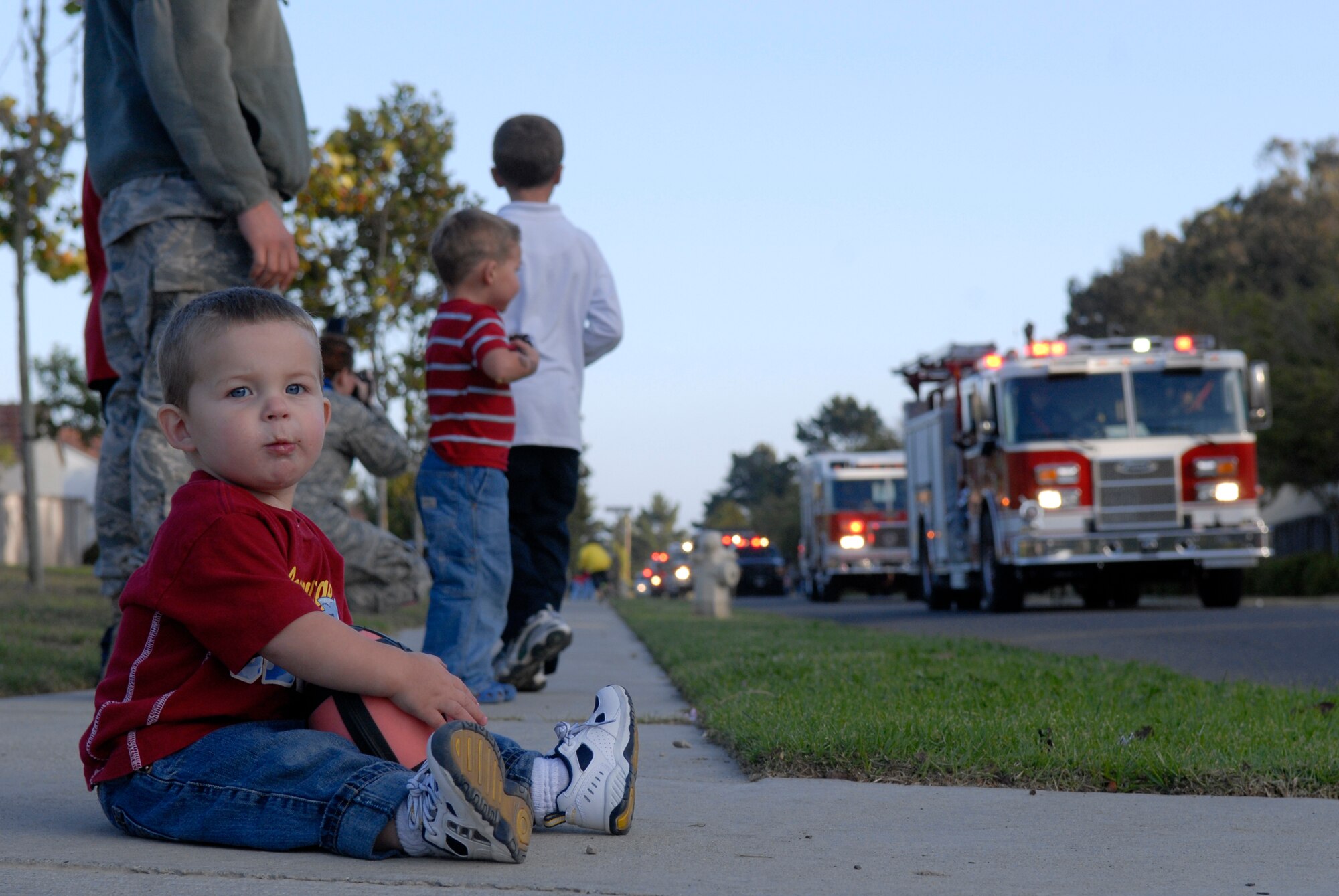 Vandenberg Air Force Base, Calif.-- A young boy sits and waits for the Vandenberg's firefighters during a Fire Prevention Week parade here Oct. 8. Firefighters held multiple events to spread the word of fire prevention and safety. (U.S. Air Force photo/Senior Airman Andrew Satran)

