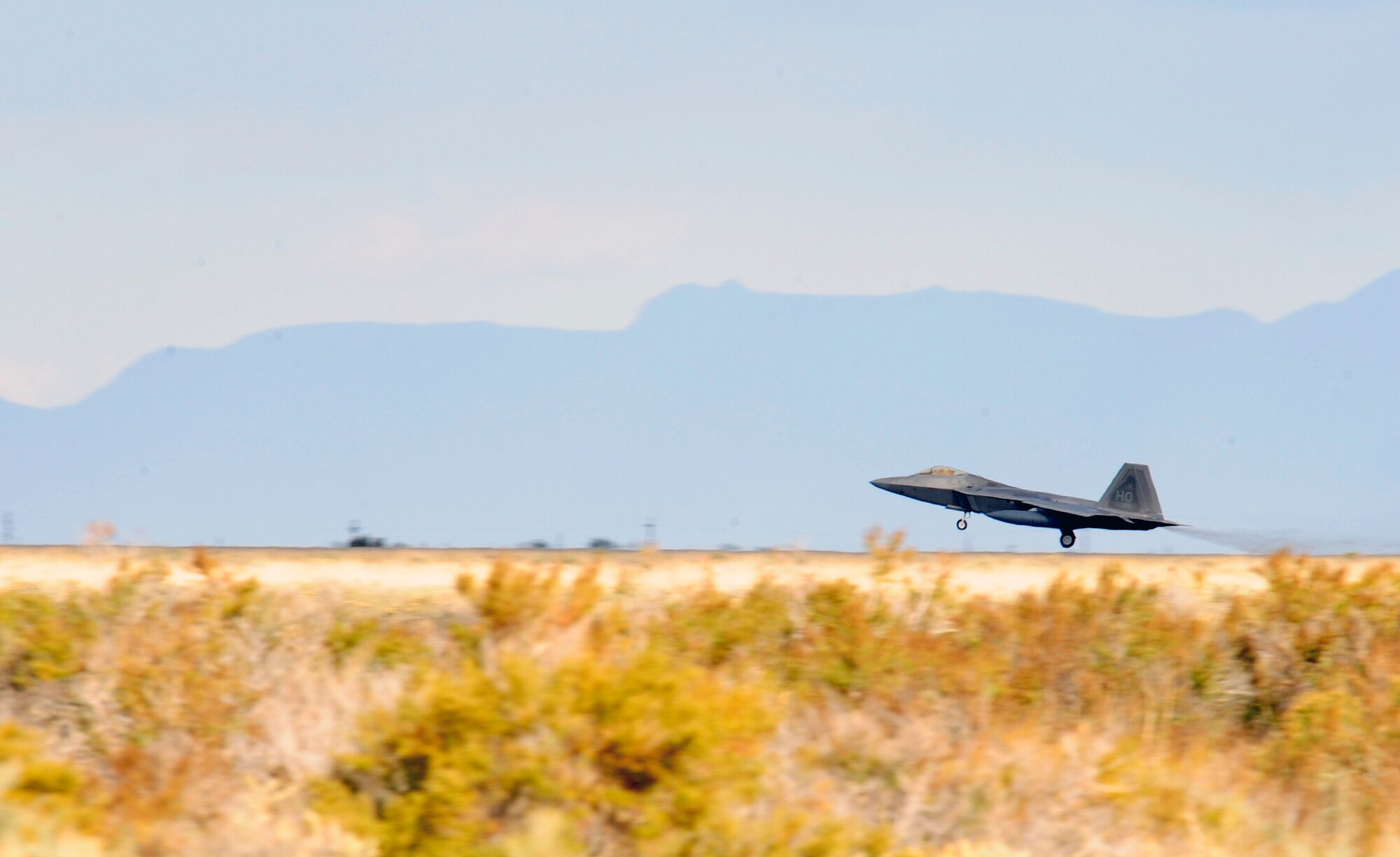 HOLLOMAN AIR FORCE BASE, N.M. -- A Holloman F-22A Raptor launches in response to an exercise tasking Oct. 8 during a weeklong exercise here. Launching the aircraft in a minimal amount of time showcased the ability of Holloman's maintainers and operators to overcome any obstacle to ensure aircraft from the 49th FW are on time and on target to fly, fight and win. (U.S. Air Force photo by Senior Airman Tiffany Trojca)