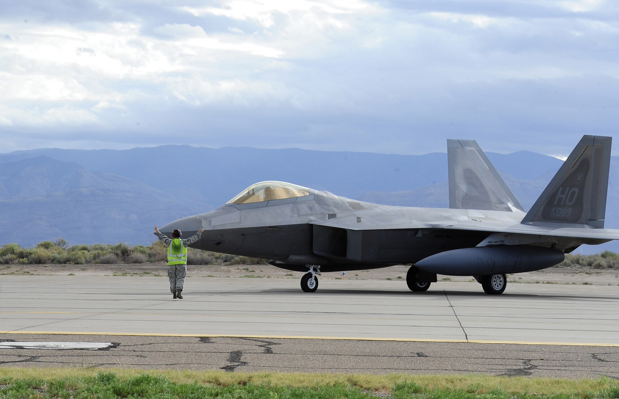 HOLLOMAN AIR FORCE BASE, N.M. -- An F-22A Raptor waits on the ramp here to launch in response to an exercise tasking Oct. 8 during a weeklong exercise. Launching the aircraft in a minimal amount of time showcased the ability of Holloman's maintainers and operators to overcome any obstacle to ensure aircraft from the 49th FW are on time and on target to fly, fight and win. (U.S. Air Force photo by Senior Airman Tiffany Trojca)