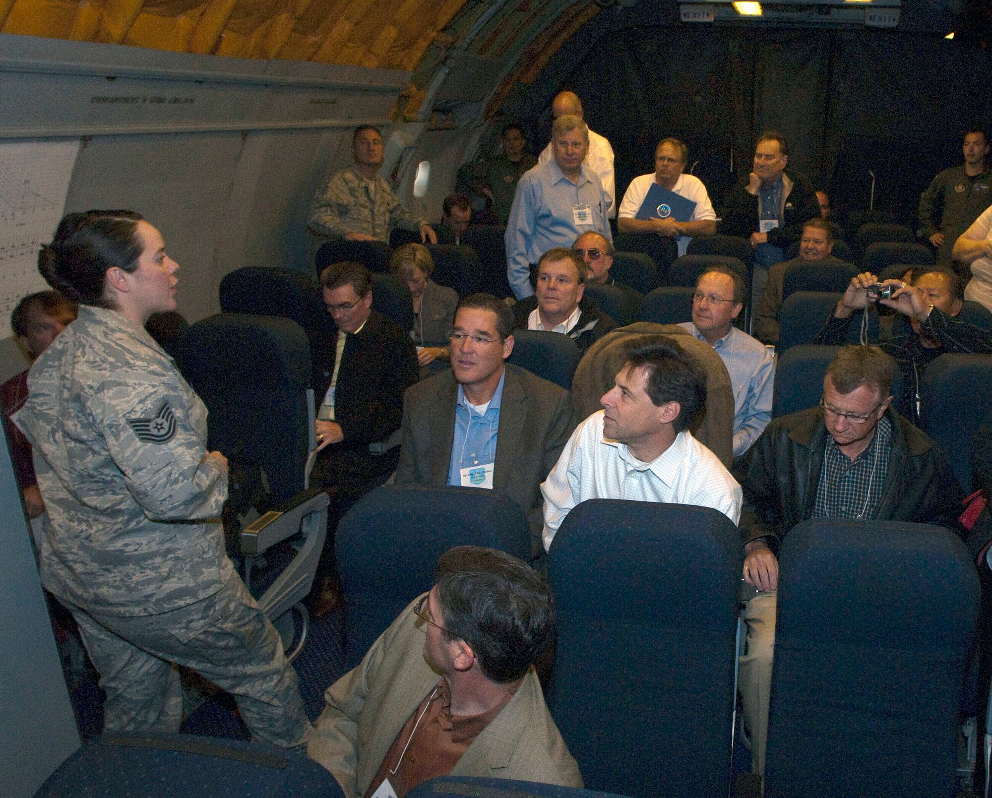 Tech. Sgt. Jill LaVoie, 460th Space Wing Public Affairs, talks with civic leaders before their departure from Buckley Air Force Base Oct. 7. Some 29 civic leaders flew from Buckley to Nellis AFB, Nev. for a two-day tour that included visits of the U.S. Air Force Warfare Center and the Thunderbirds hangar. (U.S. Air Force photo/Senior Master Sgt. John Rohrer) 