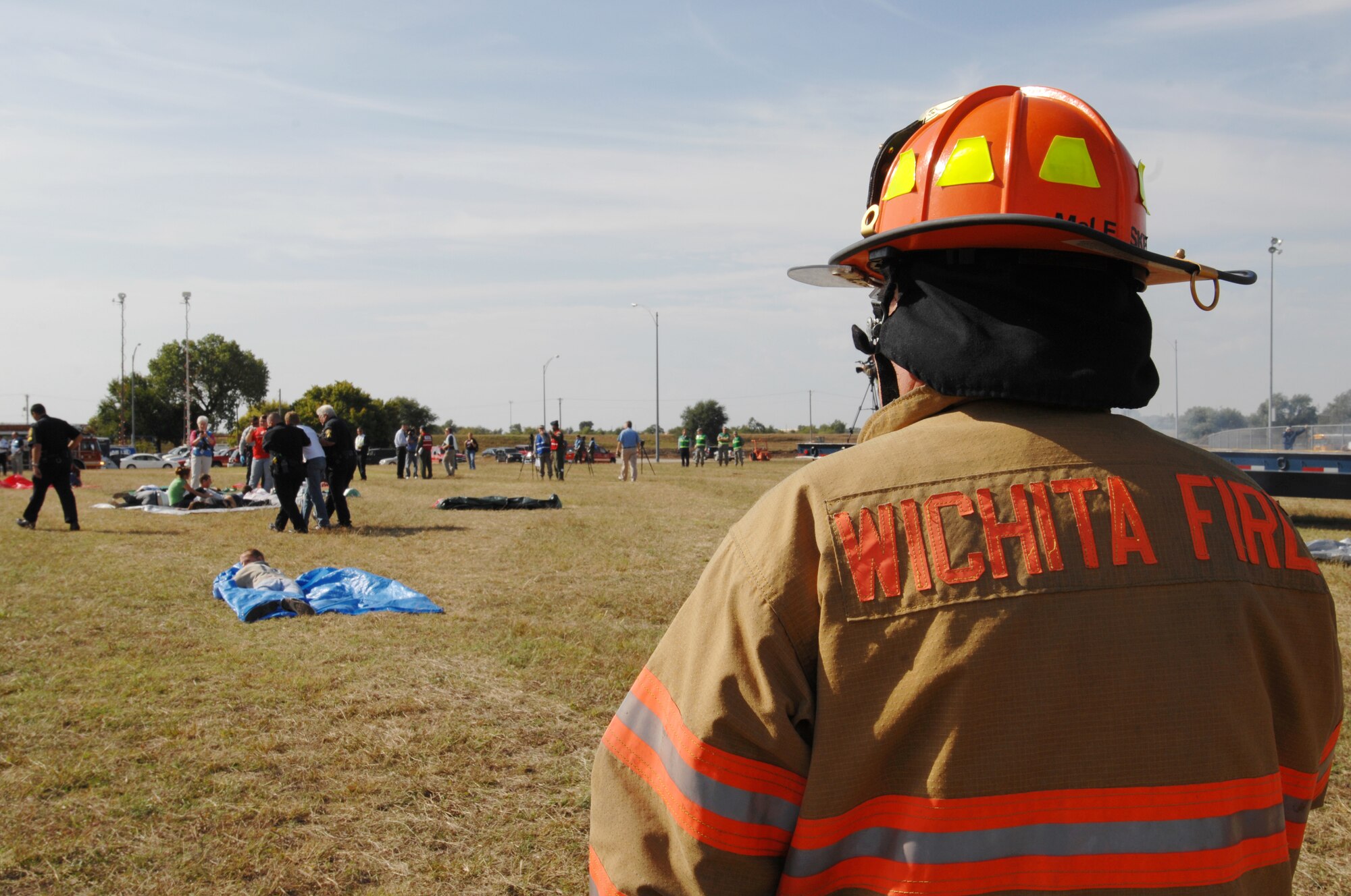 John McLesky, Wichita Fire Department firefighter, oversees a simulated aircraft crash scene, Sept. 30, 2009, in Haysville, Kan., during a major accident response exercise. More than 200 people participated in the off-base MARE. (U.S. Air Force photo/Staff Sgt. Jamie Train)
