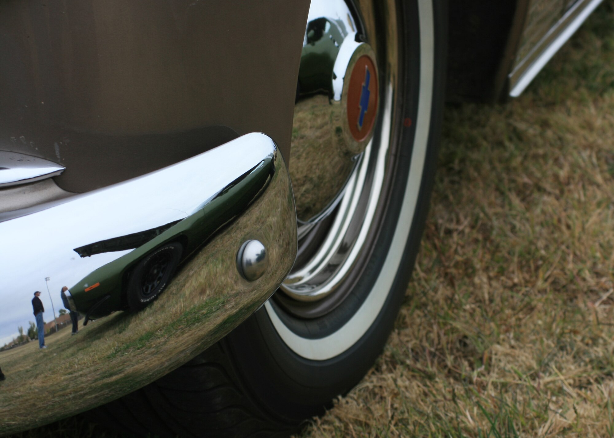 CANNON AIR FORCE BASE, N.M. -- A bumper shined to perfection reflects the shadow of a muscle car on display at the Cannon Thunder Auto Show Oct. 2 at Doc Stewart Park. A total of 64 cars were on display at this third annual event, an increase of 14 from last year's event. (Courtesy photo by Steve Lambert)