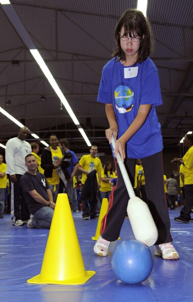 SPANGDAHLEM AIR BASE, Germany – Anne Putzer races through a stickball course Oct. 9. Anne was one of about 100 children with special needs from Bitburg’s St. Martin’s School and Department of Defense Dependants Schools-Europe to attend the Special Children’s Day held at the Skelton Memorial Fitness Center. The event required about 200 volunteers to help the children with games, lunch and an award ceremony at the end. (U.S. Air Force photo/Senior Airman Benjamin Wilson)
