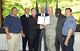 Defense Logistics Agency leaders gathered to sign a proclamation for the Voluntary Protection Plan Oct. 1. From left: Phillip Lee; Michael Yort; James Schmidt, AFGE Local 916 Union president; Patrick Cobain; Col. Kelly Larson, DLA Oklahoma City commander; Augustus Mays, Defense Distribution Depot director; and Todd Lambert, IAF Local F211 Union president. (Air Force photo by Margo Wright)