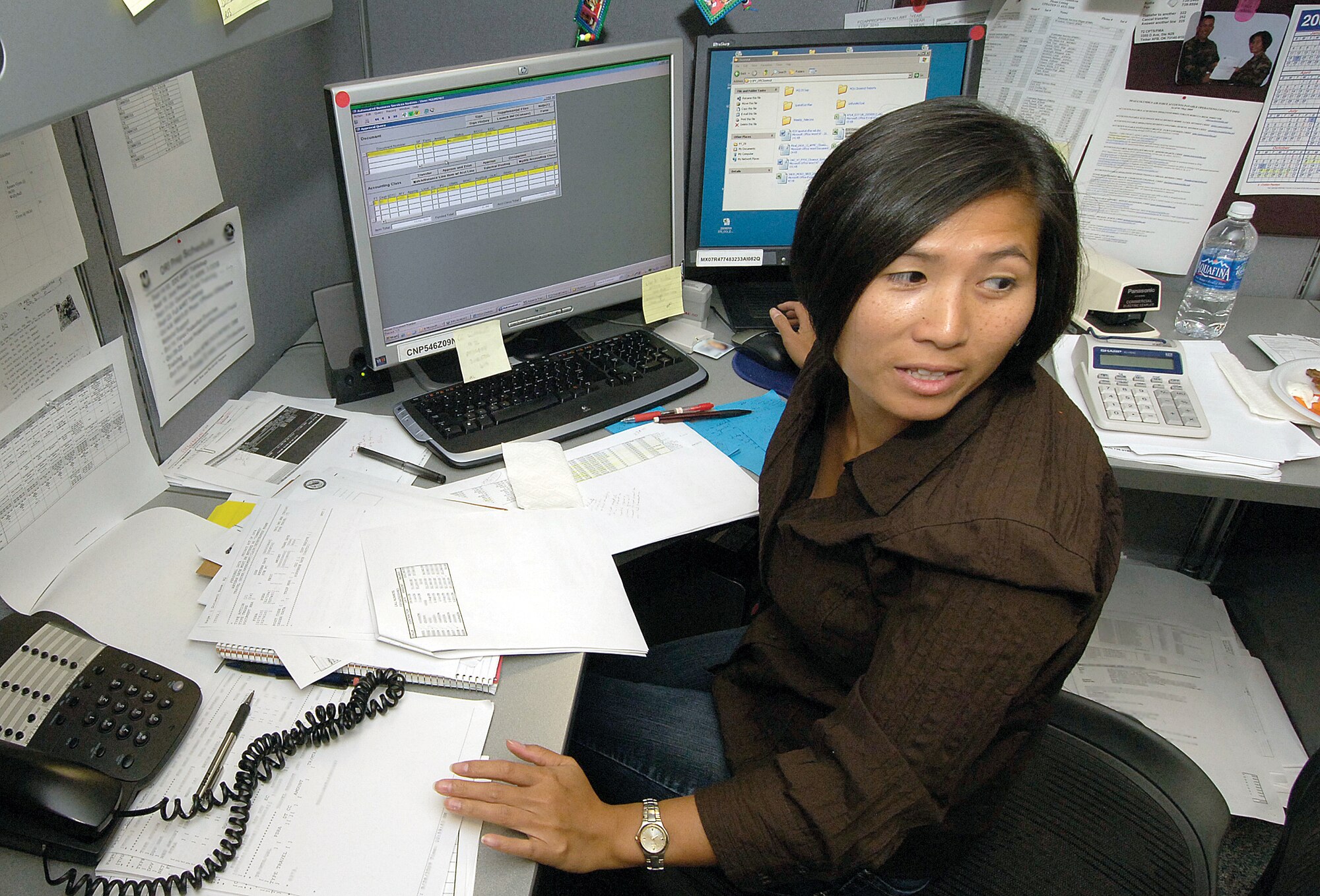 As the clock ticks toward midnight on the last day of the fiscal year, workers like Diem Nguyen of the 72nd Comptroller Squadron strive to get every dollar where it needs to be. (Air Force photo by Margo Wright) 
