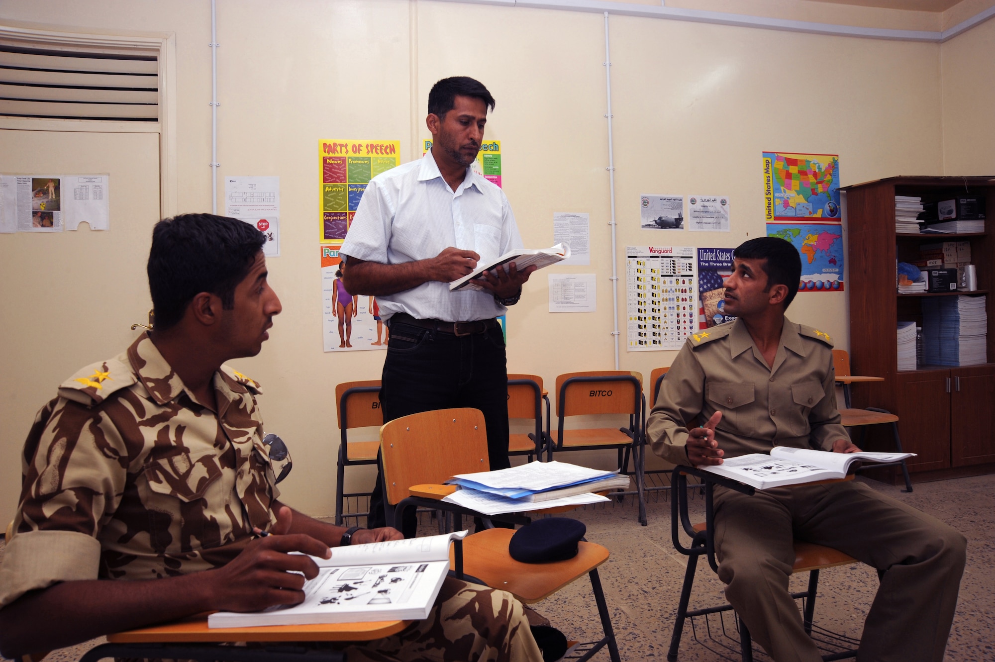 Emad teaches English to Iraqi air force officers Oct. 3, 2009, at Camp Taji, Iraq. Learning English is one of the Iraqi air force's core values, and students must successfully complete the course before moving on to pilot training. Emad is an Iraqi instructor with the 821st Expeditionary Training Squadron. U.S. Air Force instructors assigned to the 821st ETS facilitate the courses and serve as advisers to their Iraqi counterparts. (U.S. Air Force photo/Tech. Sgt. Johnny L. Saldivar) 
