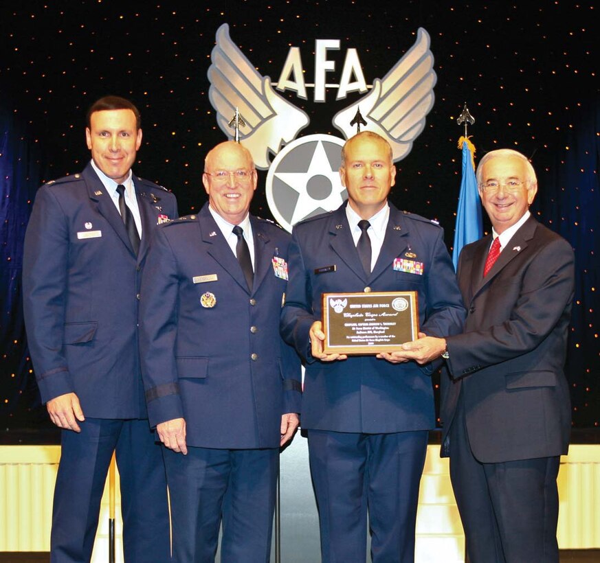 Chaplain (Capt.) Andrew Thornley, 316th Wing Chaplain, center right, receives the Air Force Association Chaplain of the Year Award for outstanding performance  from Joseph Sutter, AFA chairman of the board. Also pictured from left to right: Col. Steven M. Shepro, 316th Wing/Joint Base Andrews commander, and Ch. (Maj. Gen.) Cecil Richardson, chief of Air Force chaplains. (Courtesy Photo)