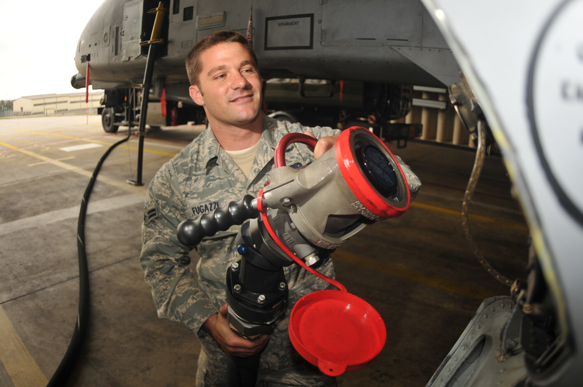 SPANGDAHLEM AIR BASE, Germany -- Airman 1st Class Dominick Fugazzi, 52nd Aircraft Maintenance Squadron, loads fuel on an A-10 Thunderbolt II on the flightline Oct. 3. Air Force crew chiefs ensure that aircraft are fully loaded with fuel before take off as part of the pre-flight inspection. (U .S. Air Force photo/Airman 1st Class Nick Wilson)