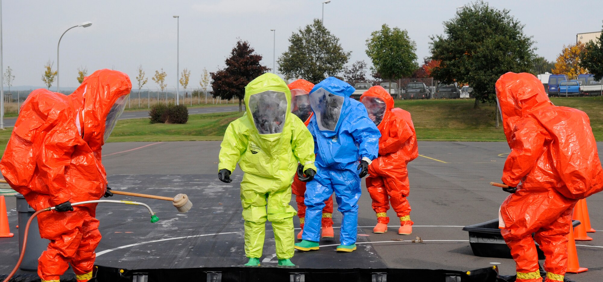 SPANGDAHLEM AIR BASE, Germany – Members from the Full-Spectrum Threat Response Strike Team, 52nd Civil Engineer Squadron, line up to simulate body decontamination during an all hazards response training emergency management and mass casualty exercise Oct. 7. The teams maintained an "all hazards" mentality to provide accurate, real-world results. (U.S. Air Force photo/Airman 1st Class Staci Miller)