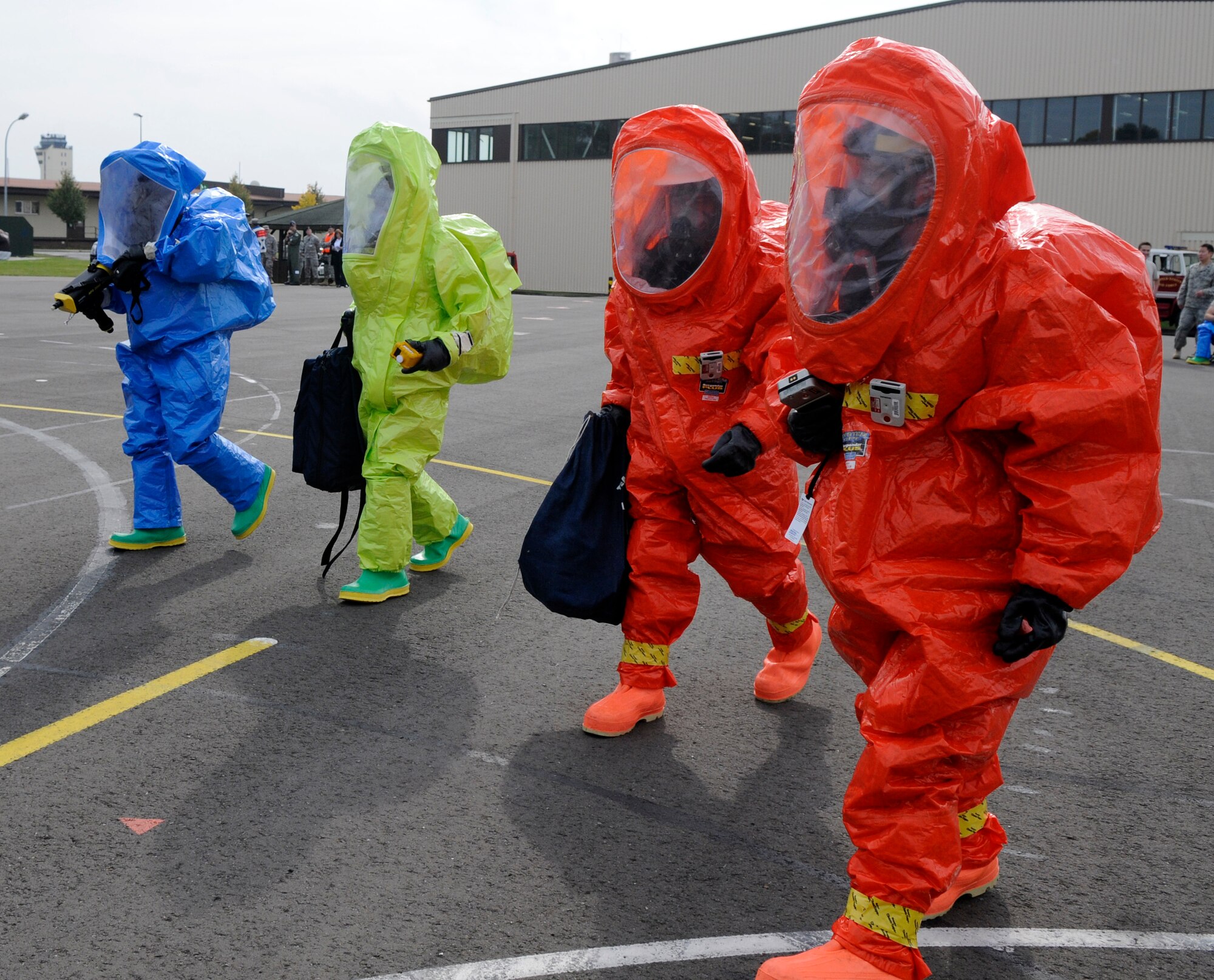 SPANGDAHLEM AIR BASE, Germany – Members from the Full-Spectrum Threat Response Strike Team, 52nd Civil Engineer Squadron, walk toward a simulated chemical attack site during an all hazards response training emergency management and mass casualty exercise Oct. 7. The teams maintained an "all hazards" mentality to provide accurate, real-world results. (U.S. Air Force photo/Airman 1st Class Staci Miller)